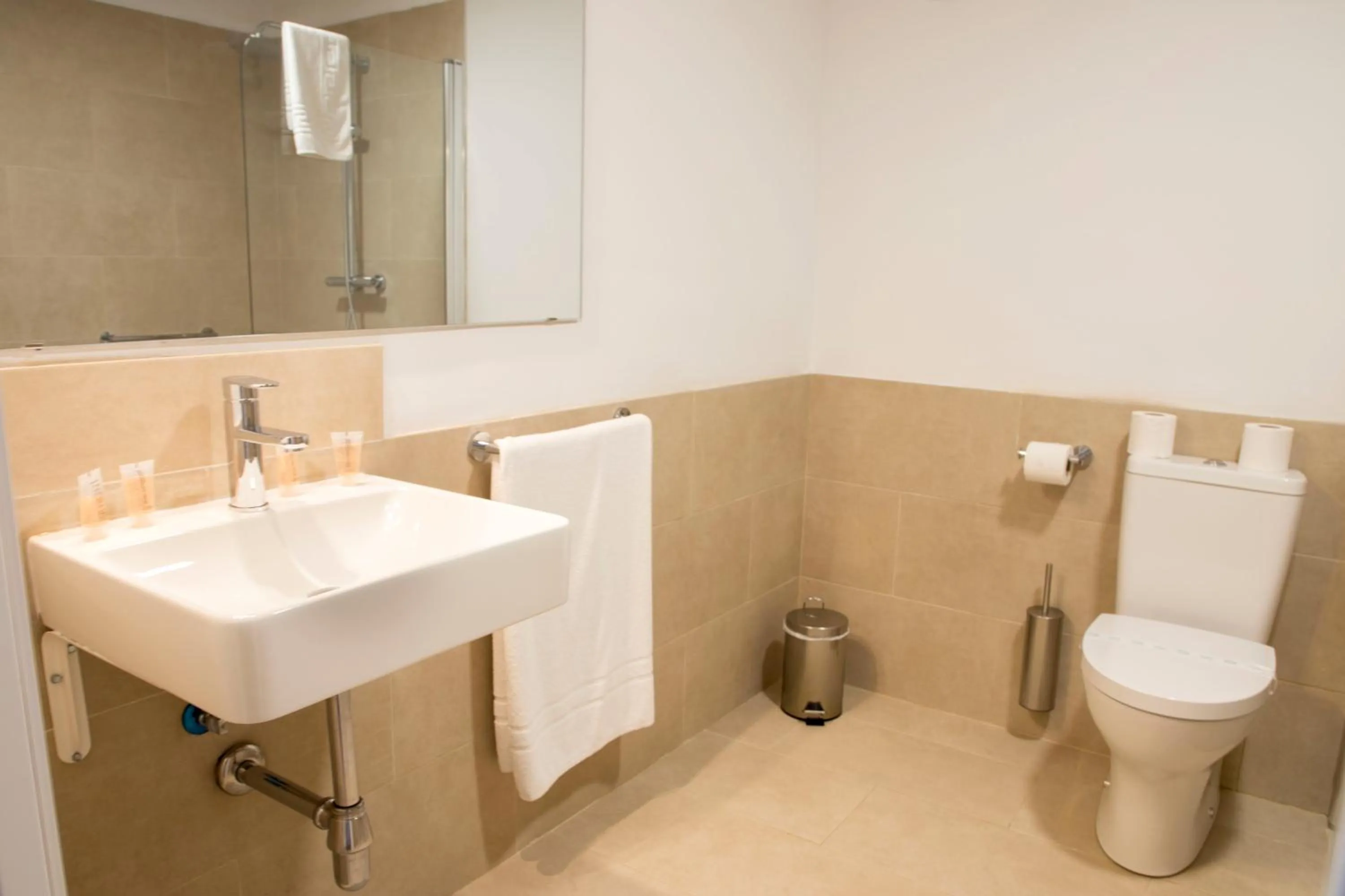 Toilet in NineSuites