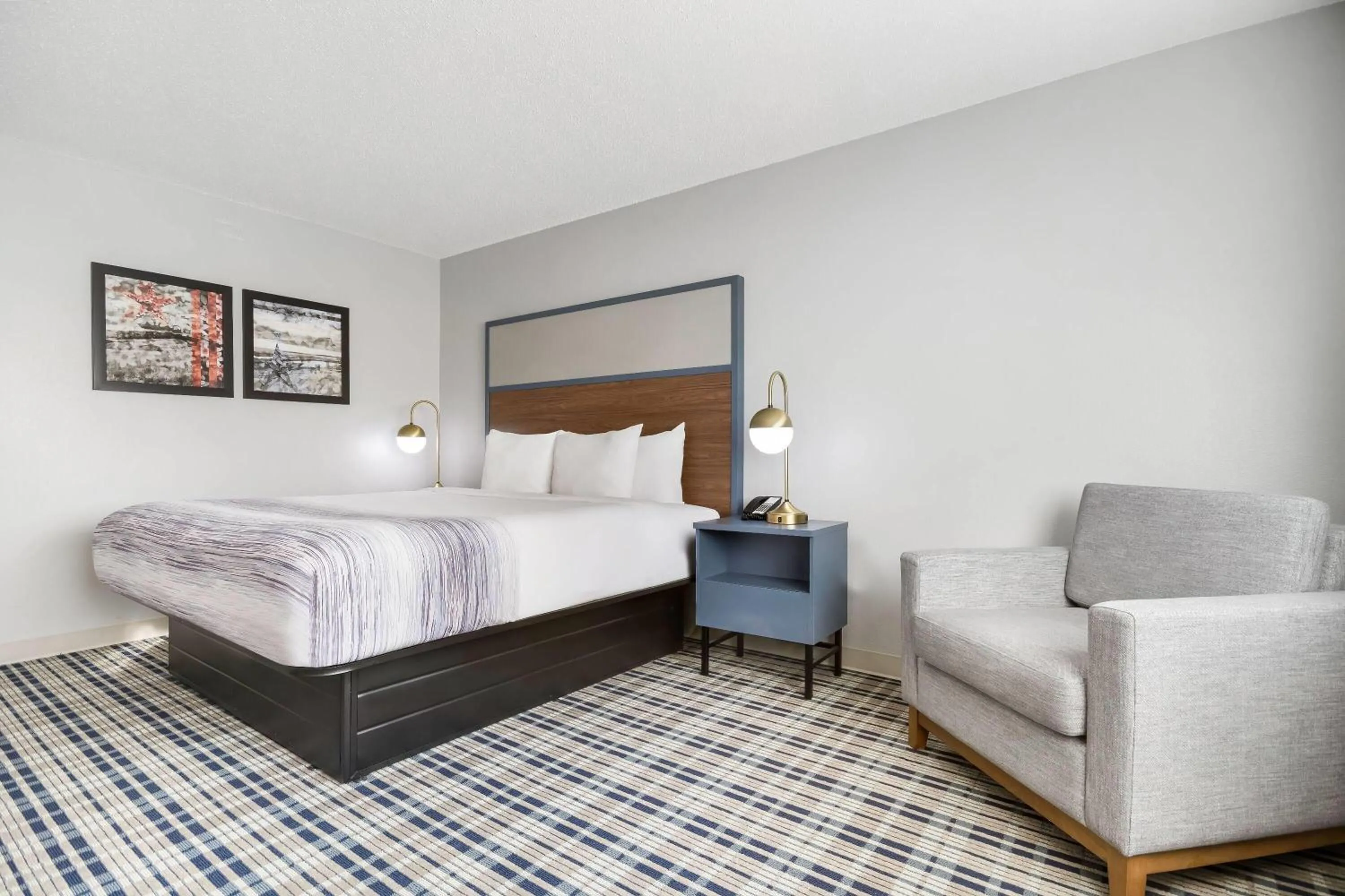 Bed in AmericInn by Wyndham Wausau