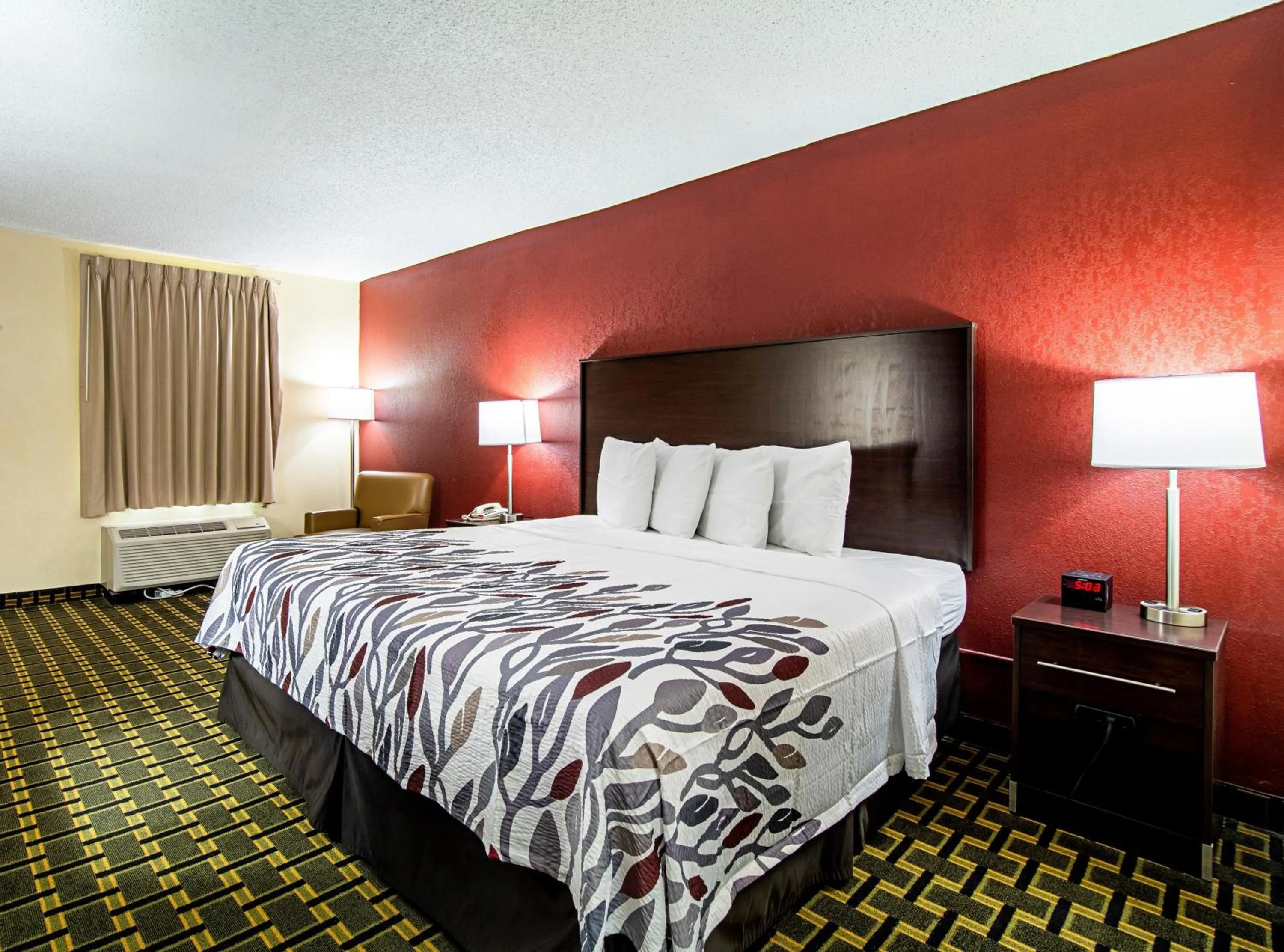 Photo of the whole room, Bed in Red Roof Inn & Suites Greenwood, SC