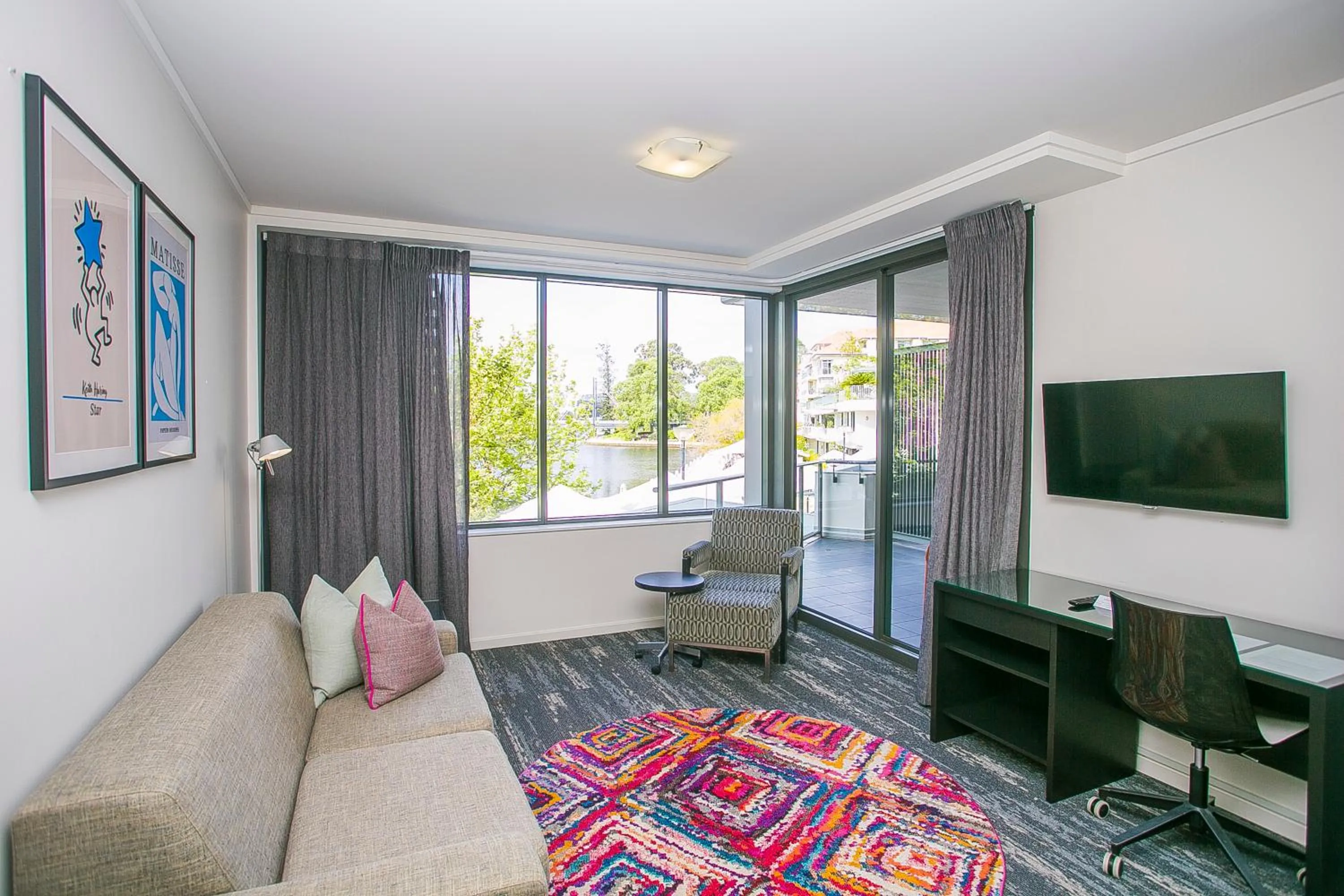 Communal lounge/ TV room in East Perth Suites Hotel