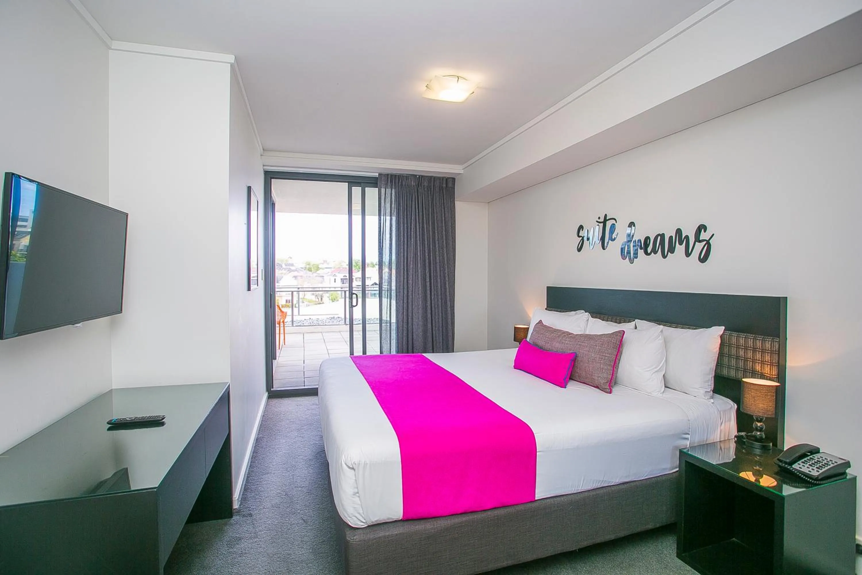Bed in East Perth Suites Hotel