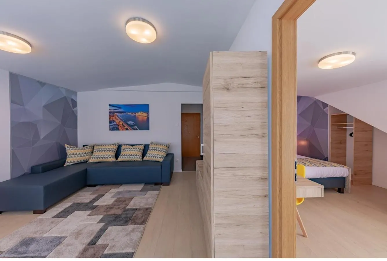 Living room, Bed in Christina Residence