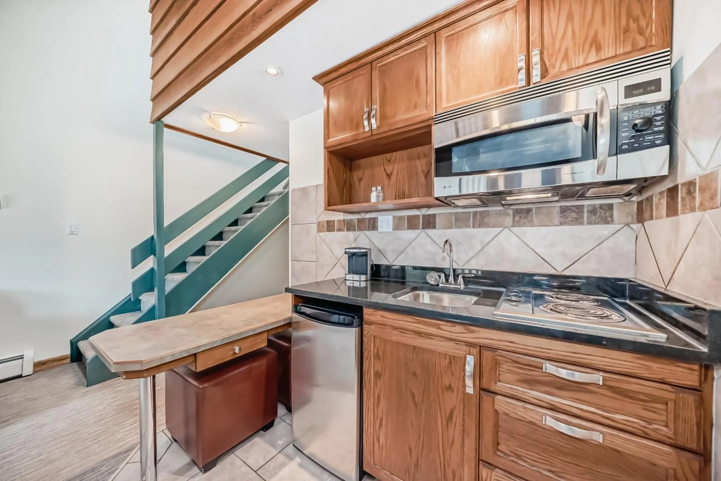 kitchen in Jasper Inn & Suites by INNhotels