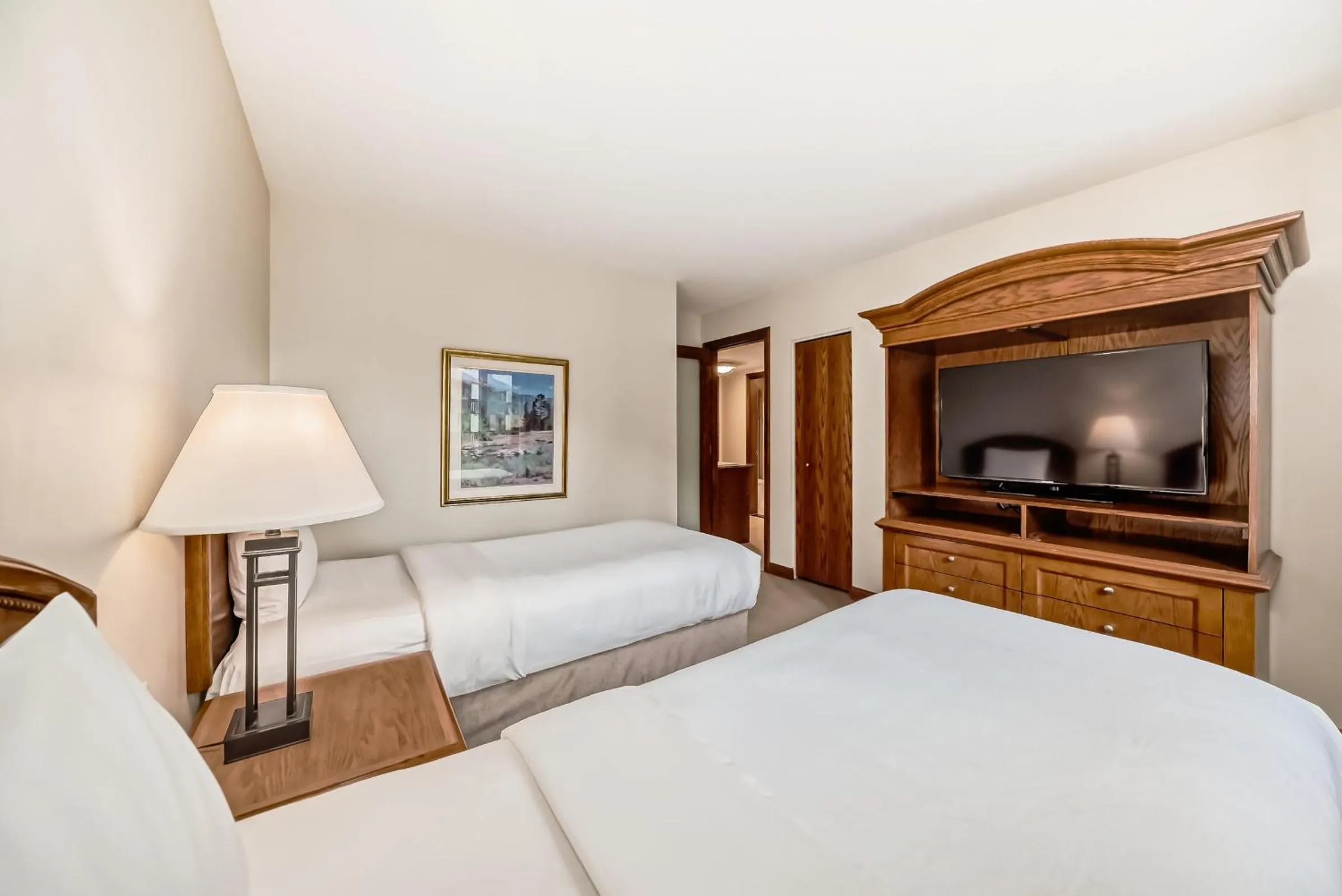 Bed in Jasper Inn & Suites by INNhotels