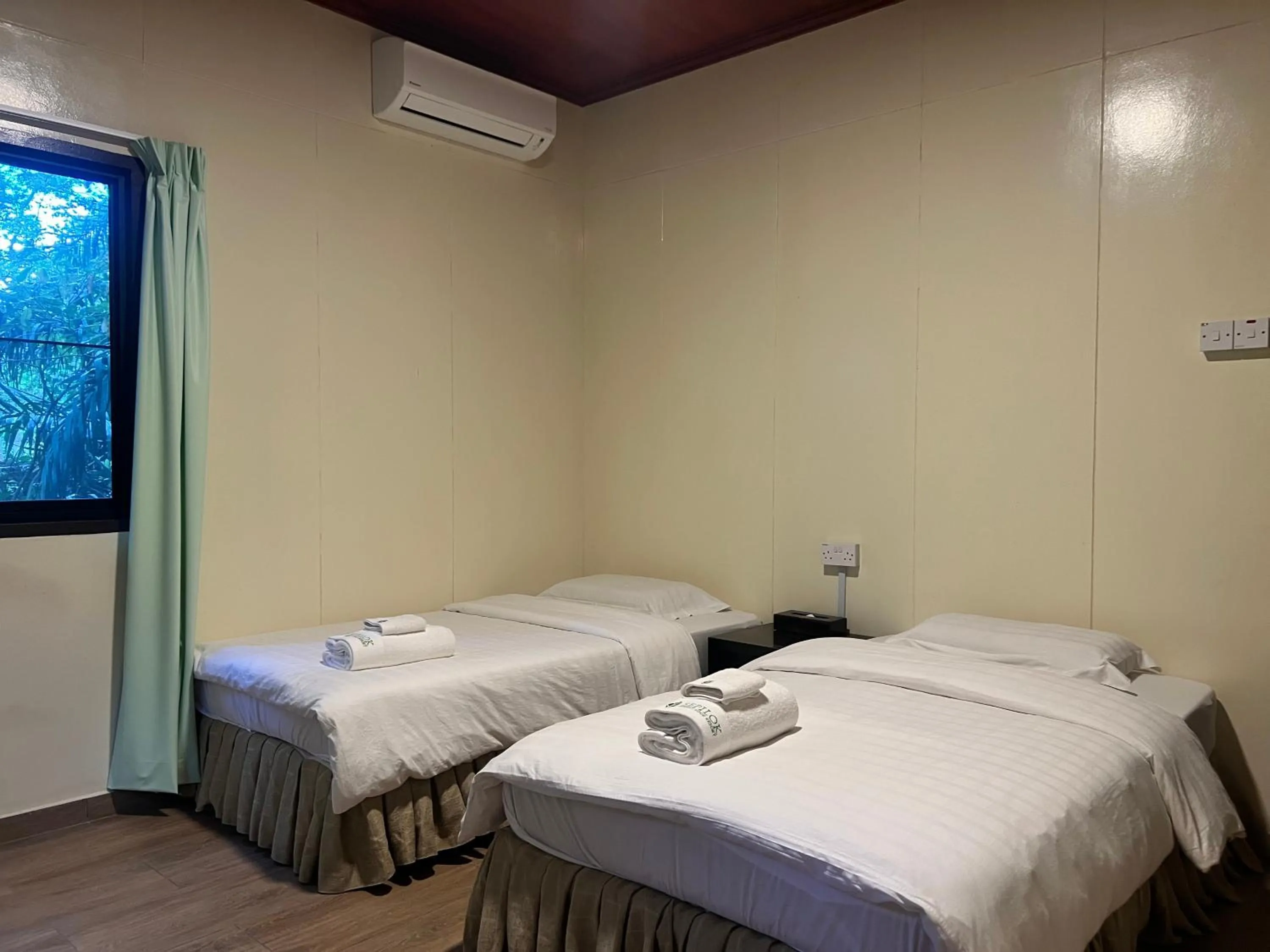 Bed in Sepilok Forest Edge Resort