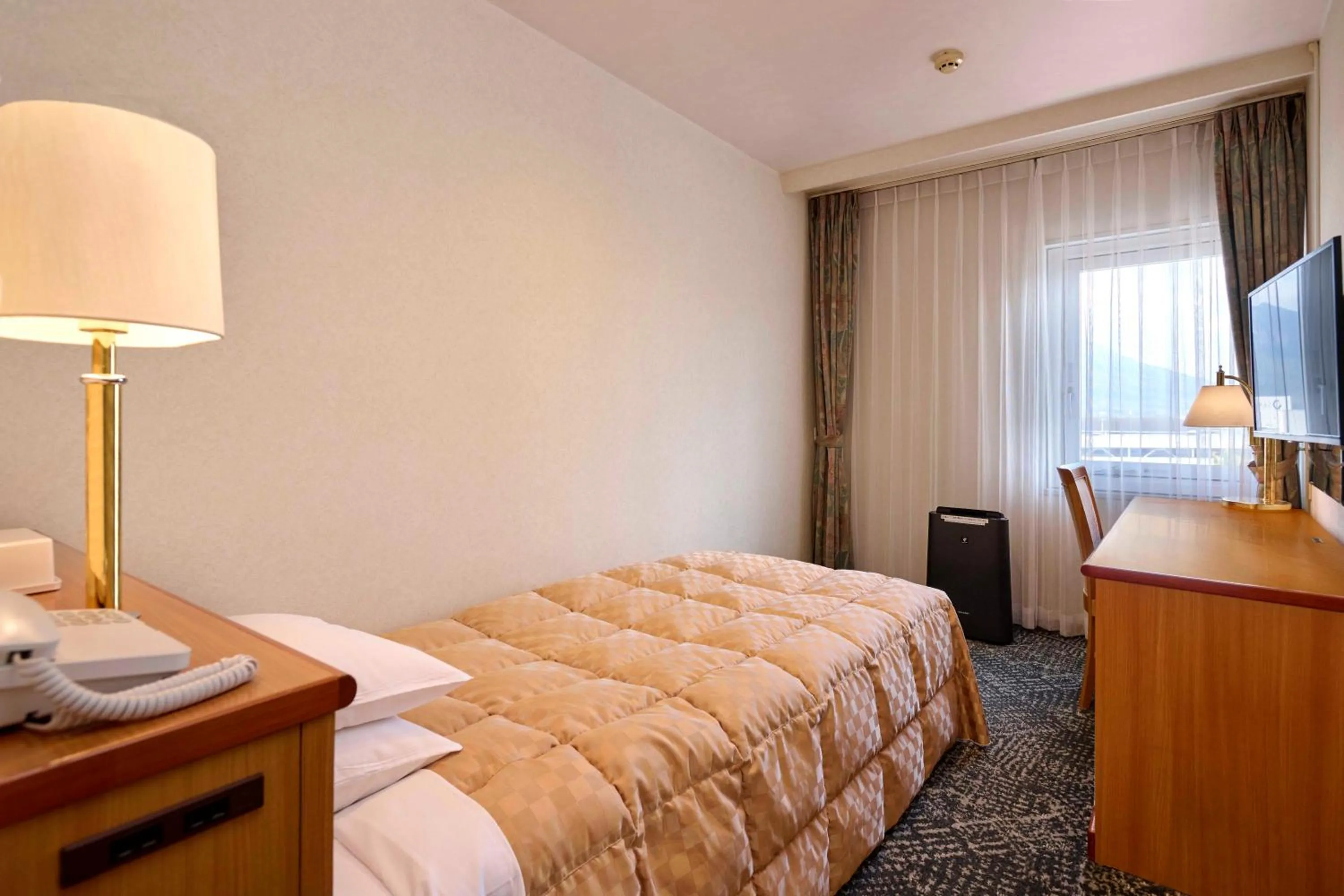 Bed in Kagoshima Sun Royal Hotel