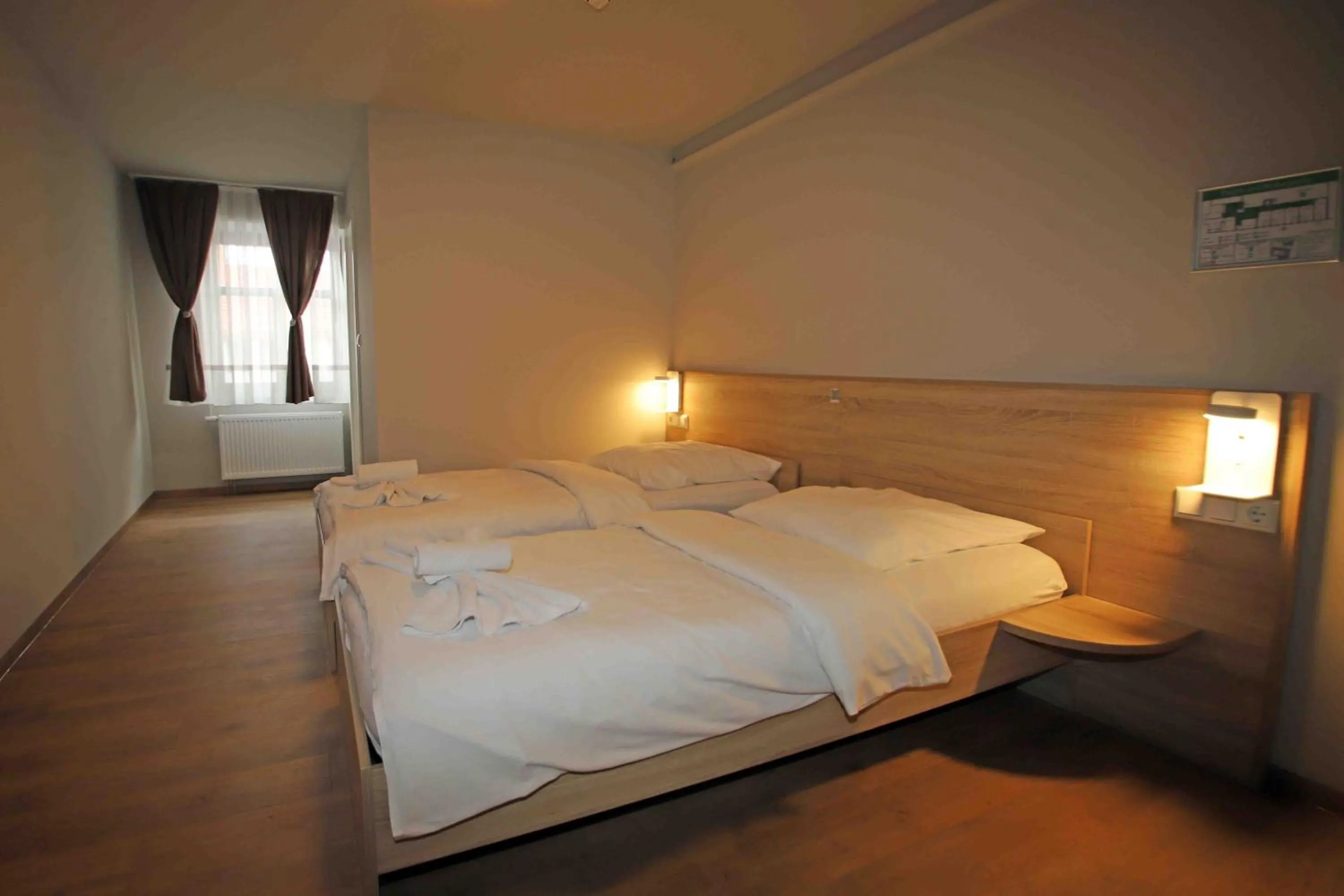 Bed in Pension Villa Colosseo im Herzen von Meiningen