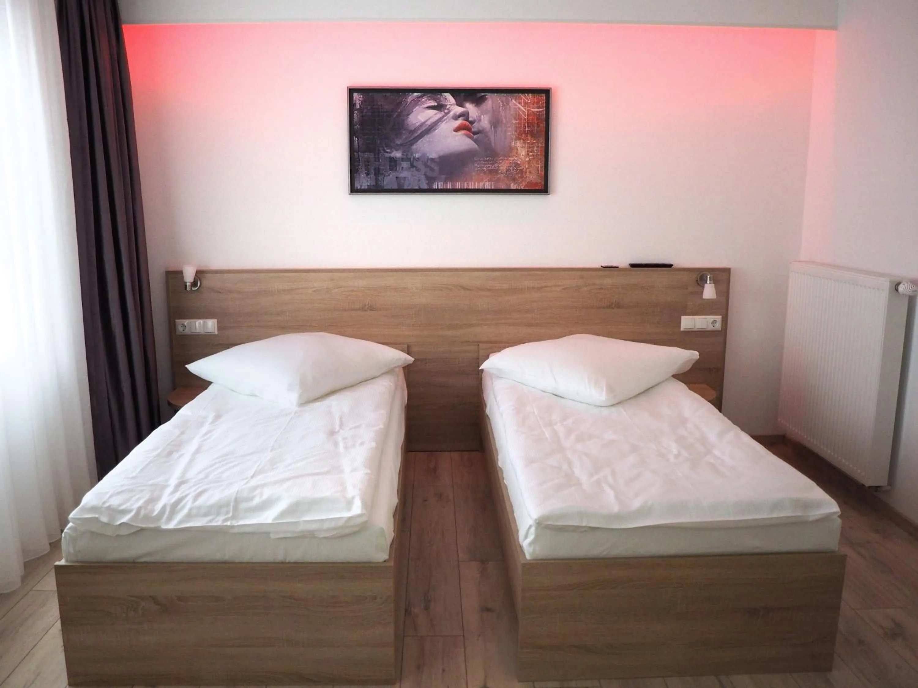 Bed in Pension Villa Colosseo im Herzen von Meiningen