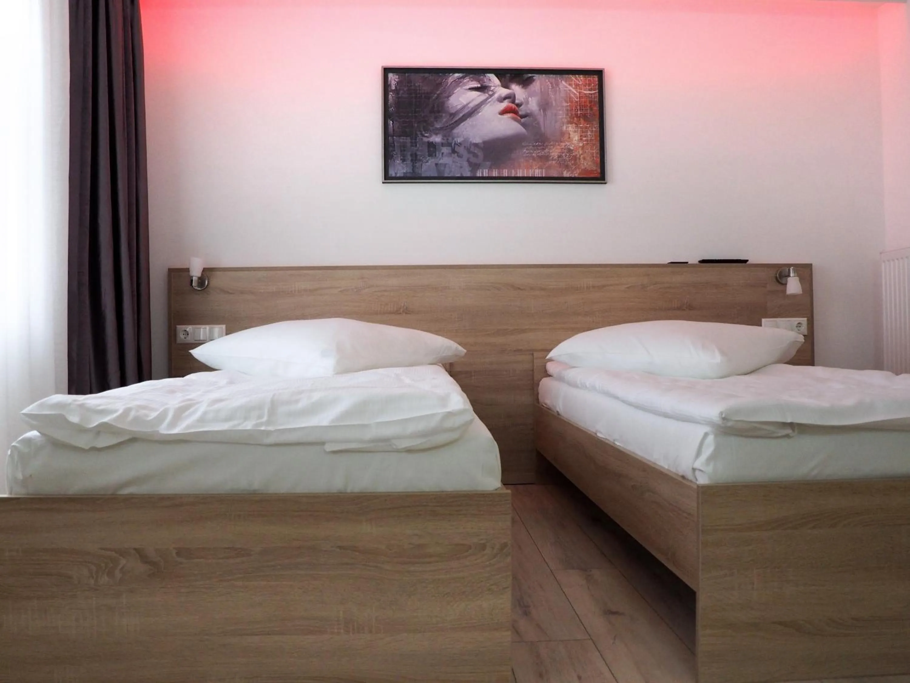 Bed in Pension Villa Colosseo im Herzen von Meiningen