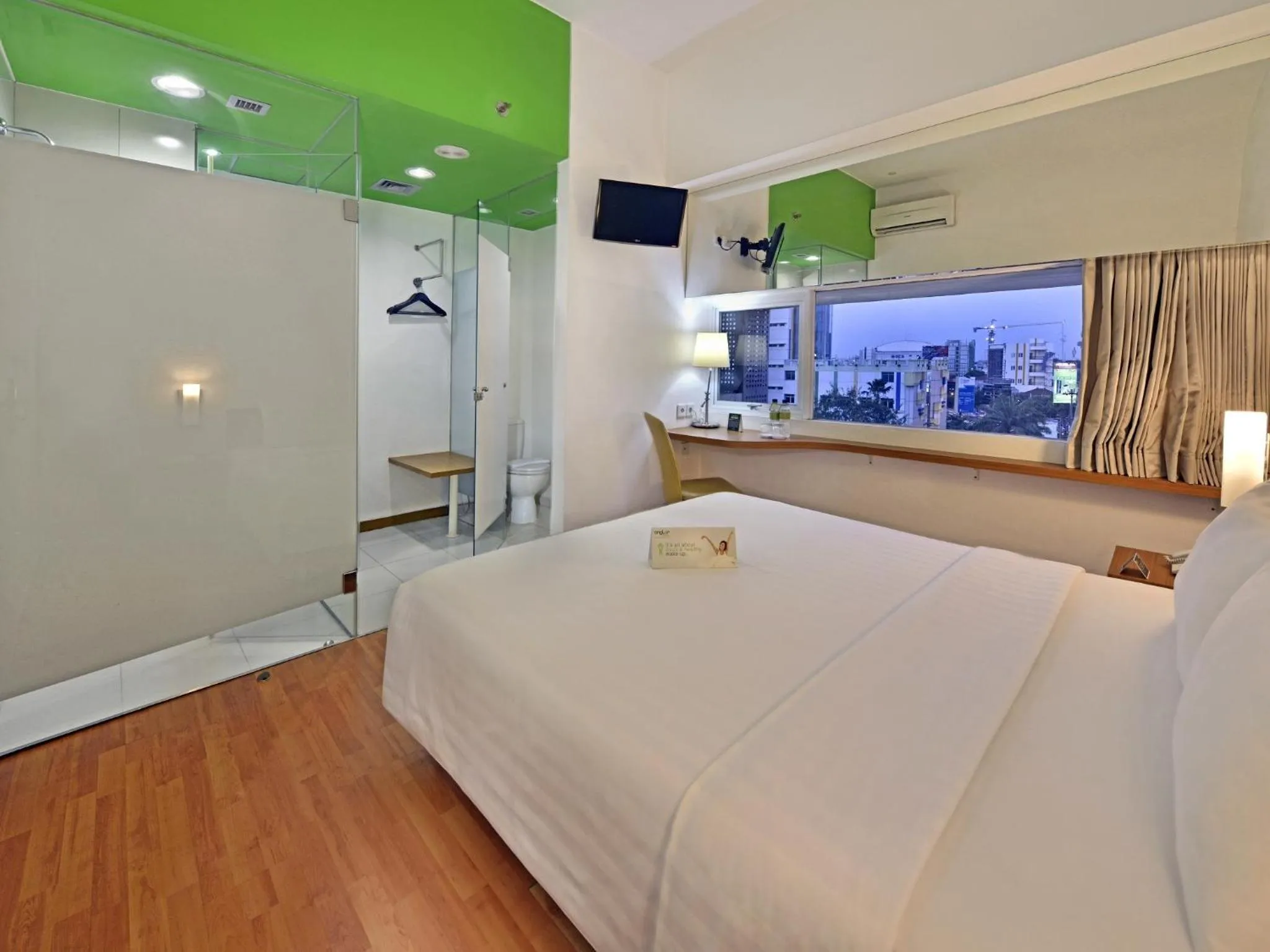 Photo of the whole room, Bed in Whiz Hotel Pemuda Semarang