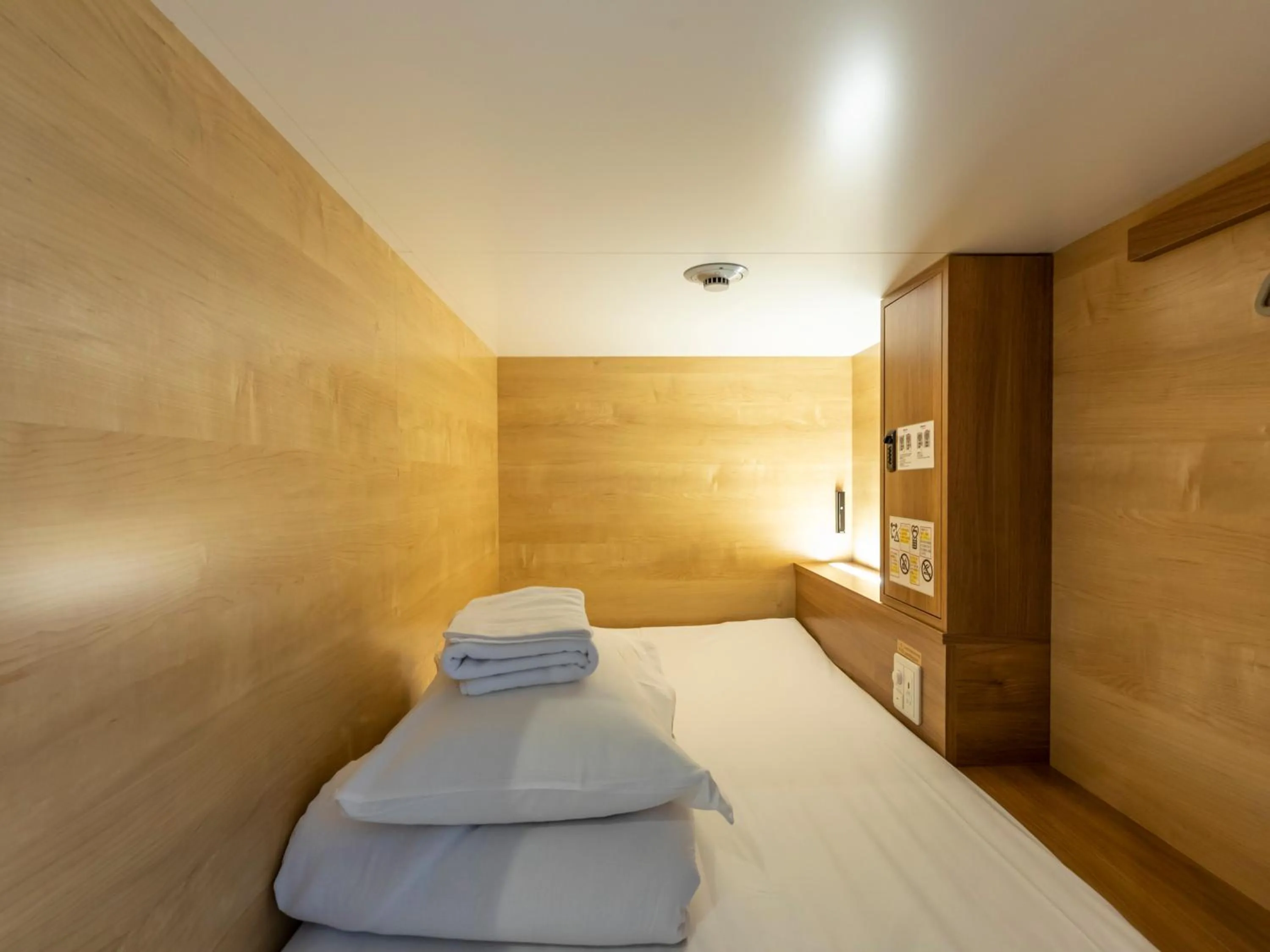 Bed in Tabist CapsuleHotel APODS Himeji Station