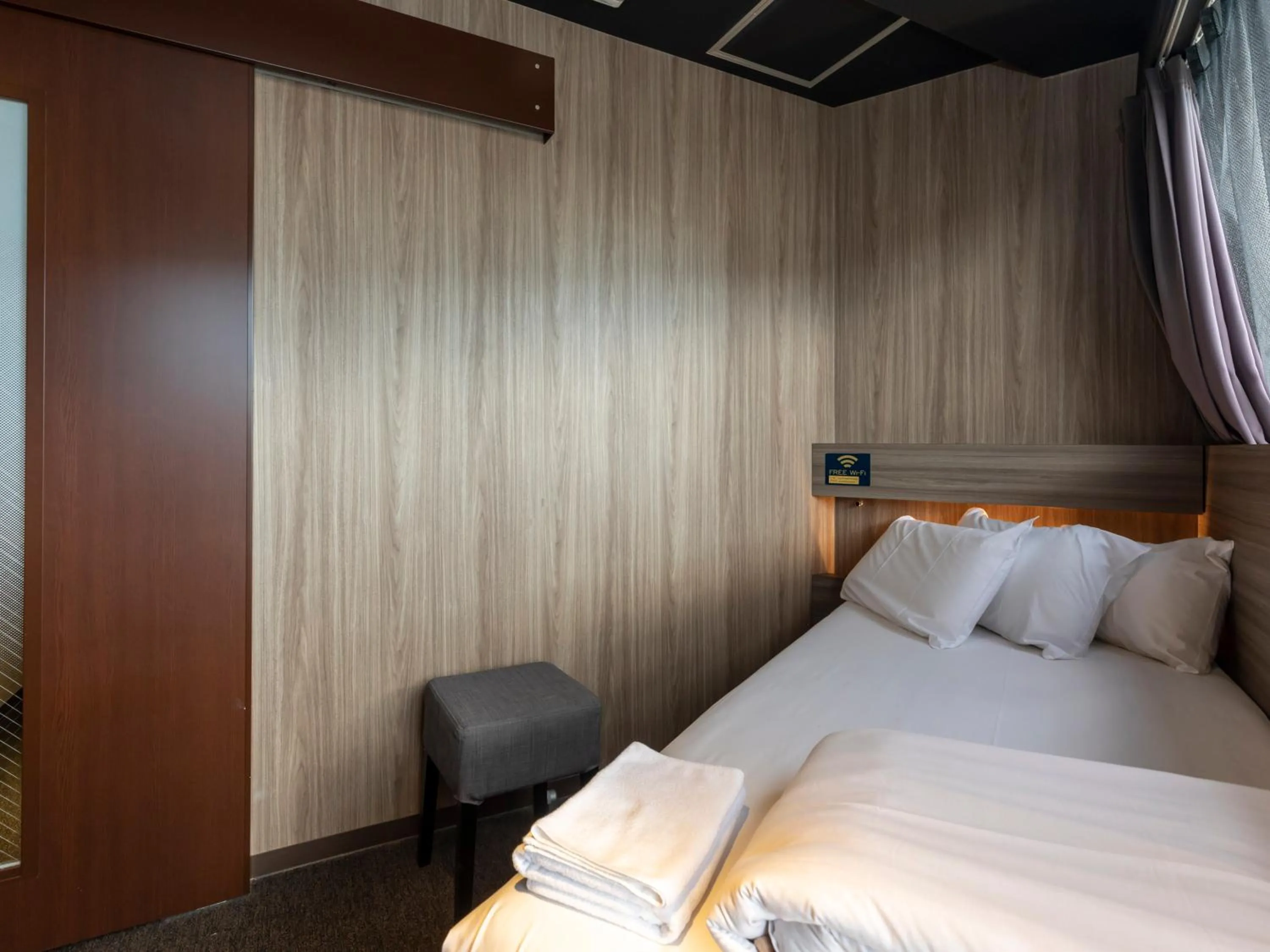 Bed in Tabist CapsuleHotel APODS Himeji Station