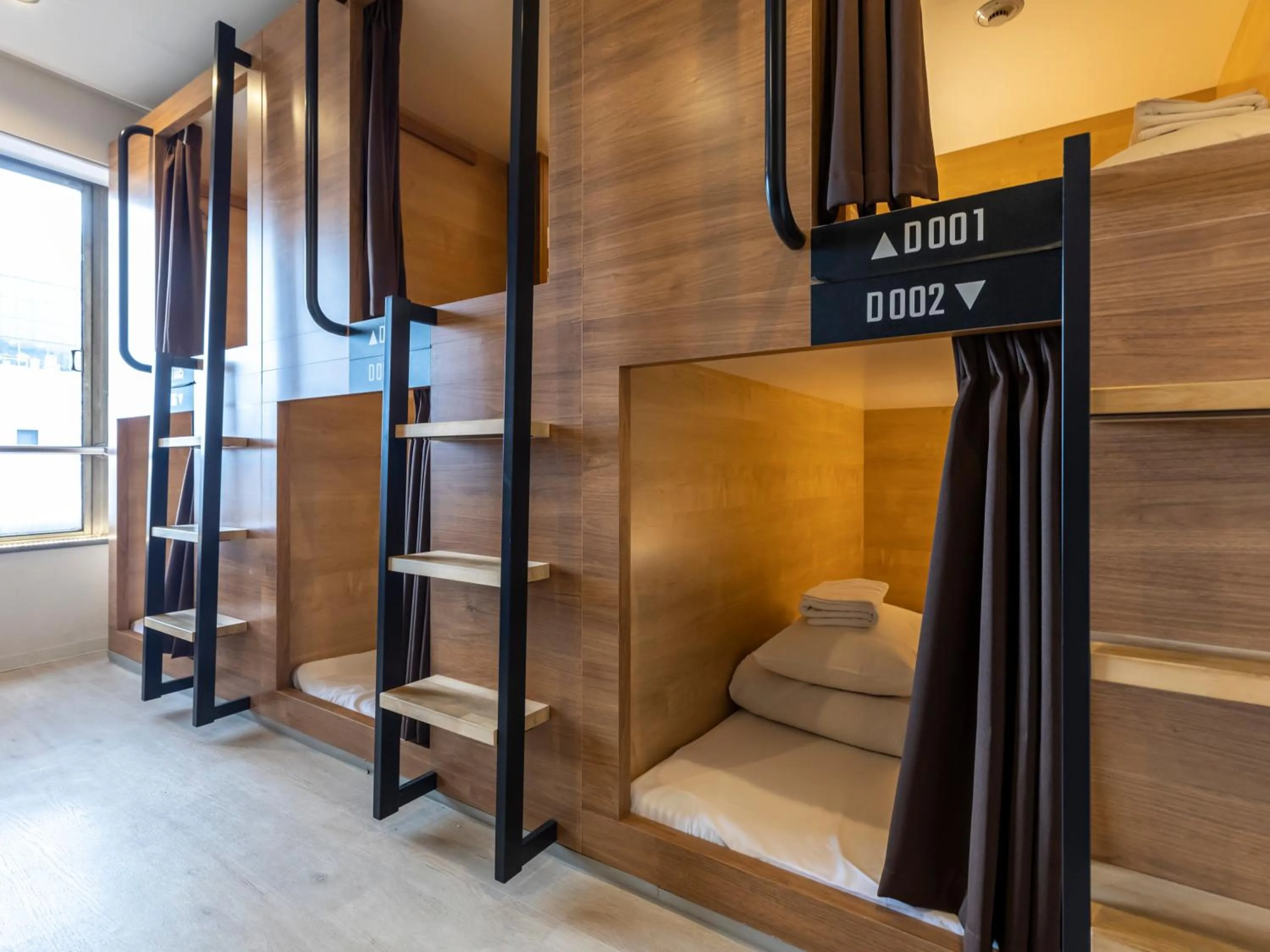 Bed in Tabist CapsuleHotel APODS Himeji Station