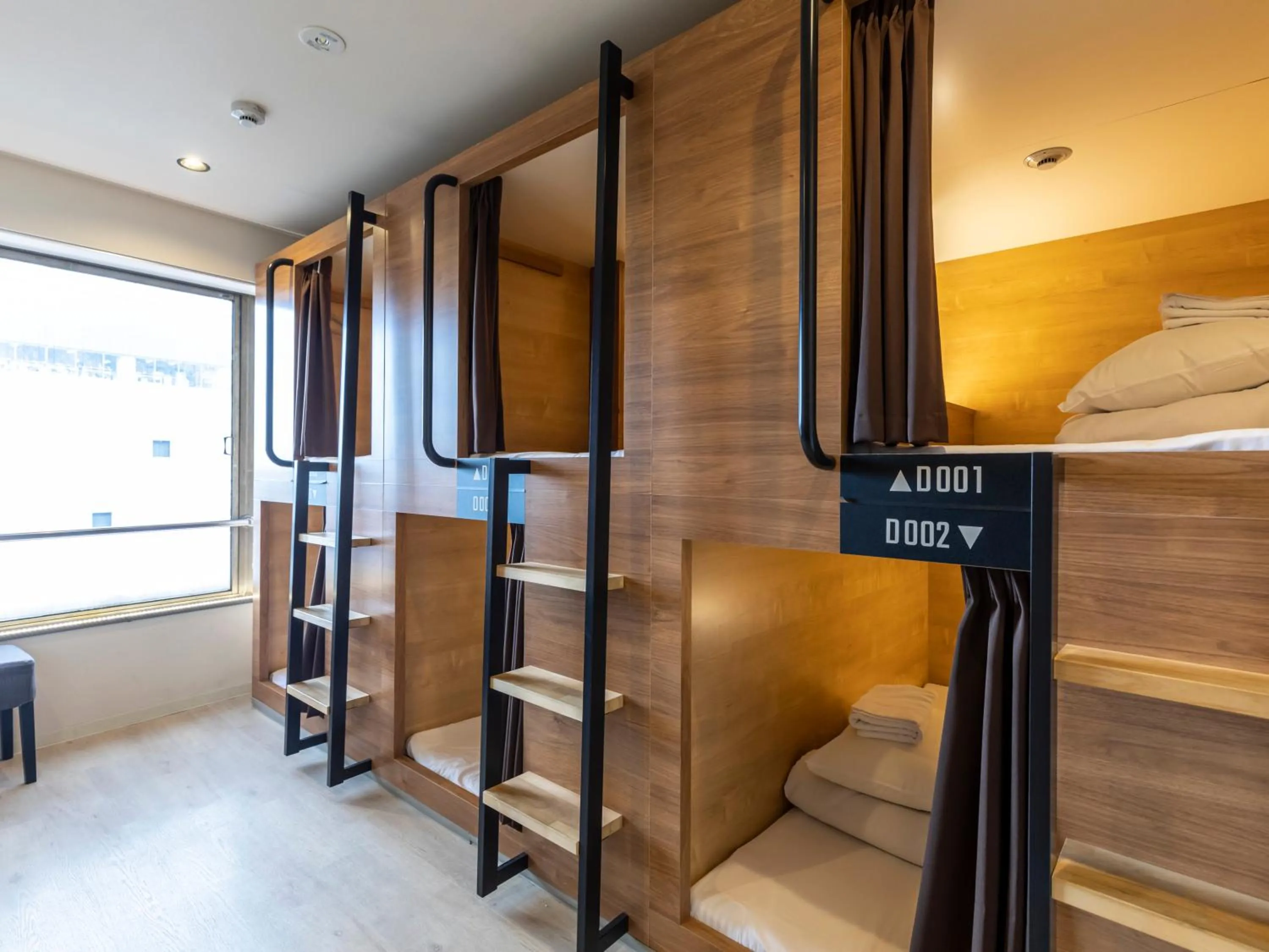 Bed in Tabist CapsuleHotel APODS Himeji Station