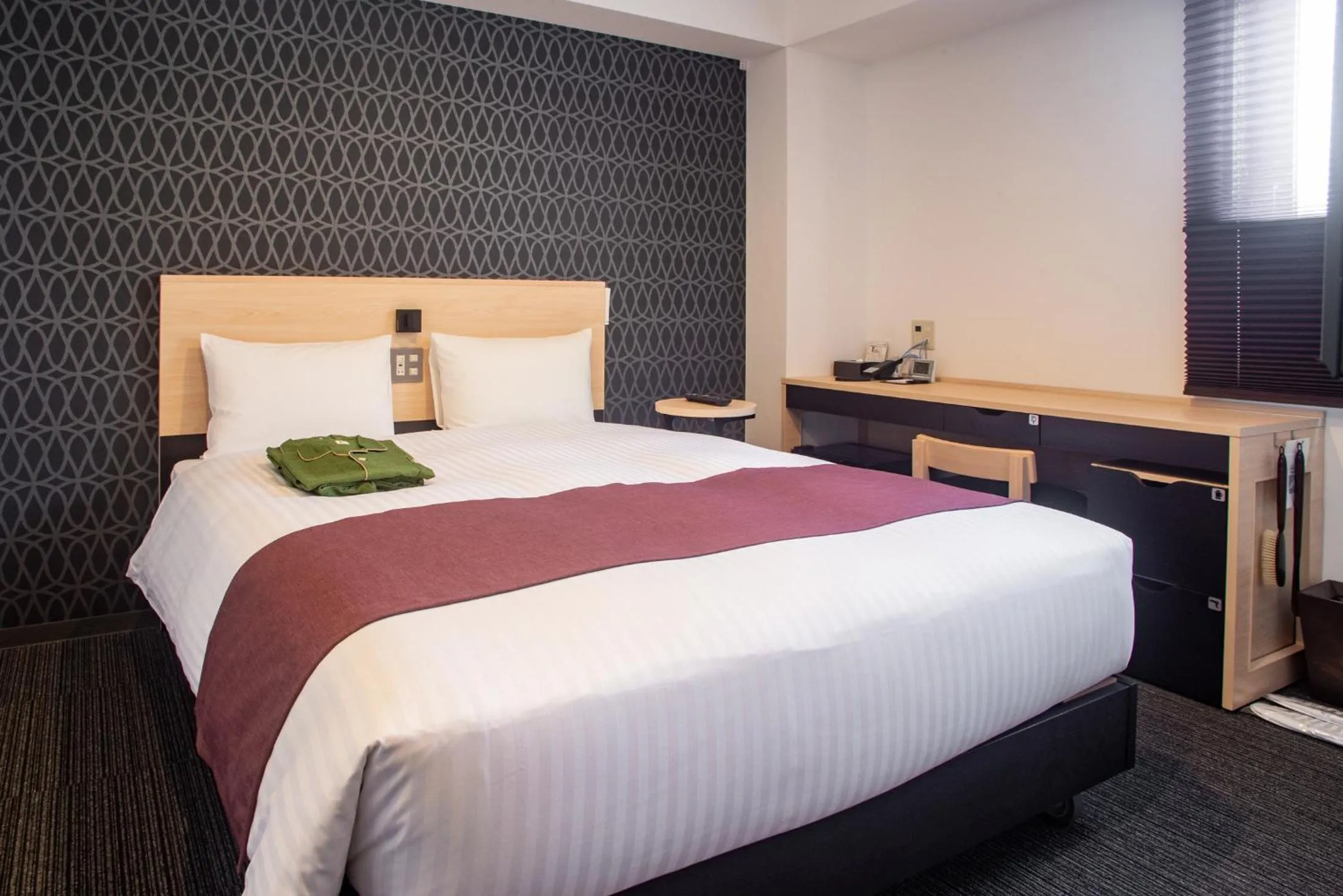 Bed in Hotel Kuretakeso Hiroshima Otemachi