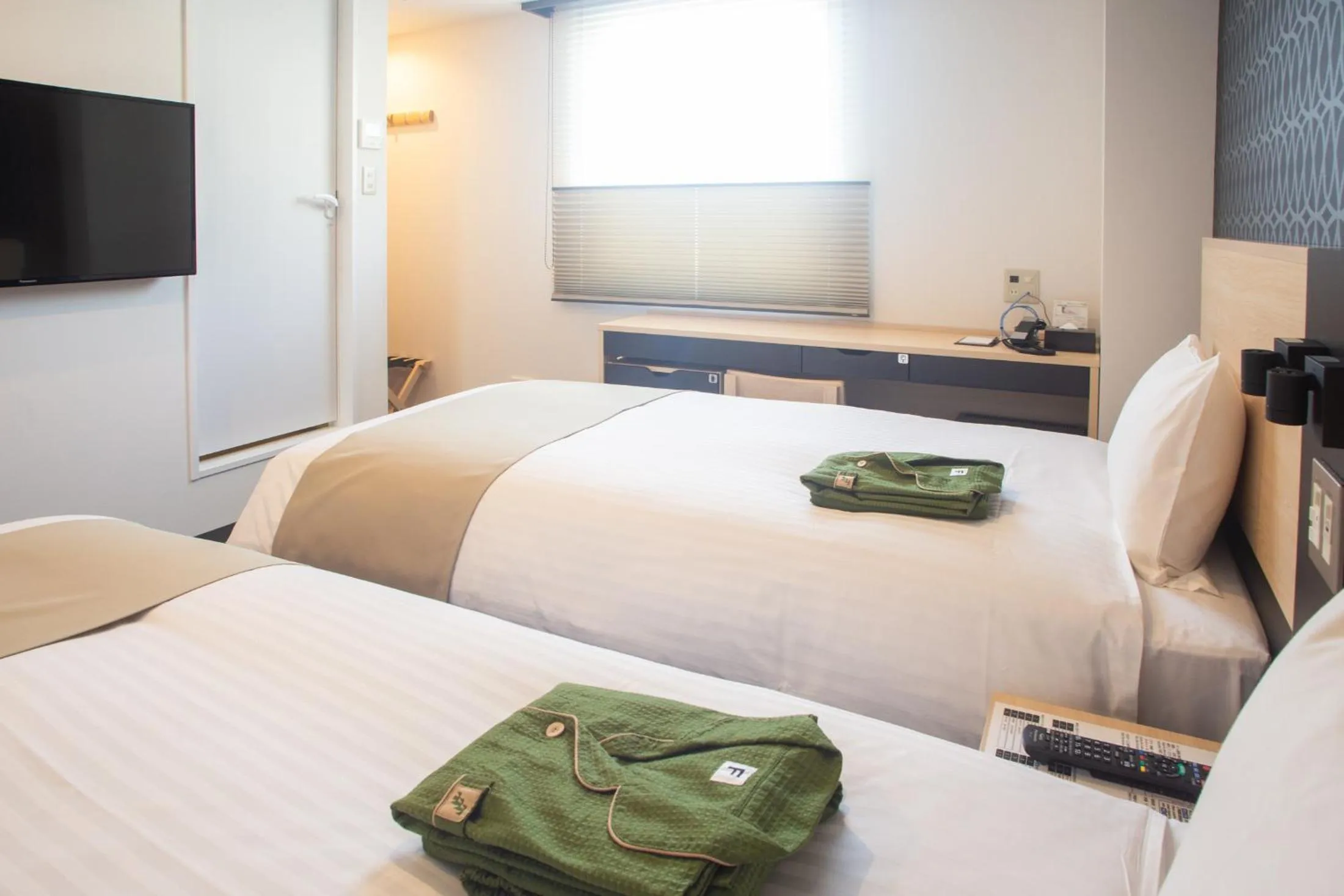 Bed in Hotel Kuretakeso Hiroshima Otemachi