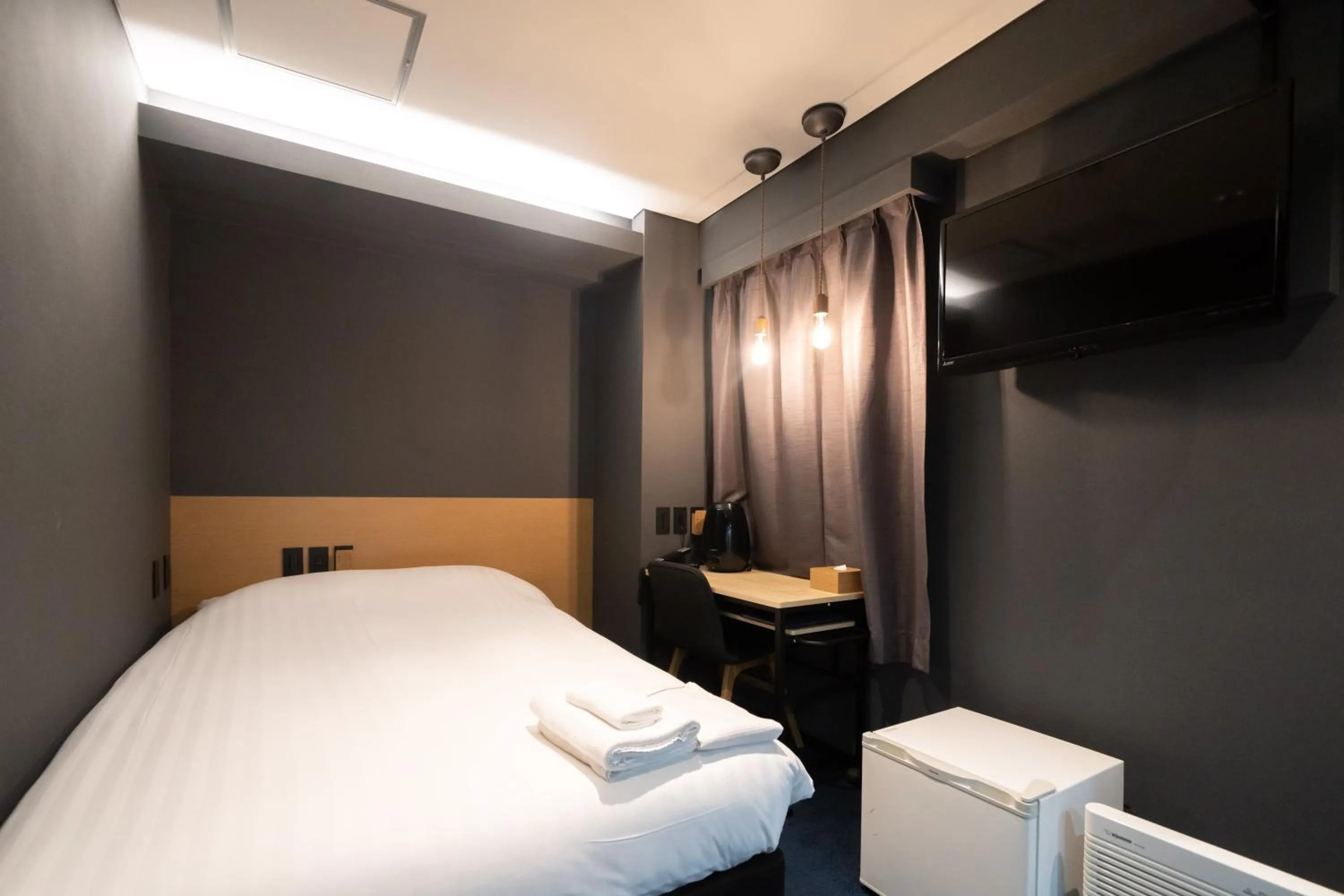 Bed in Hotel New Shohei