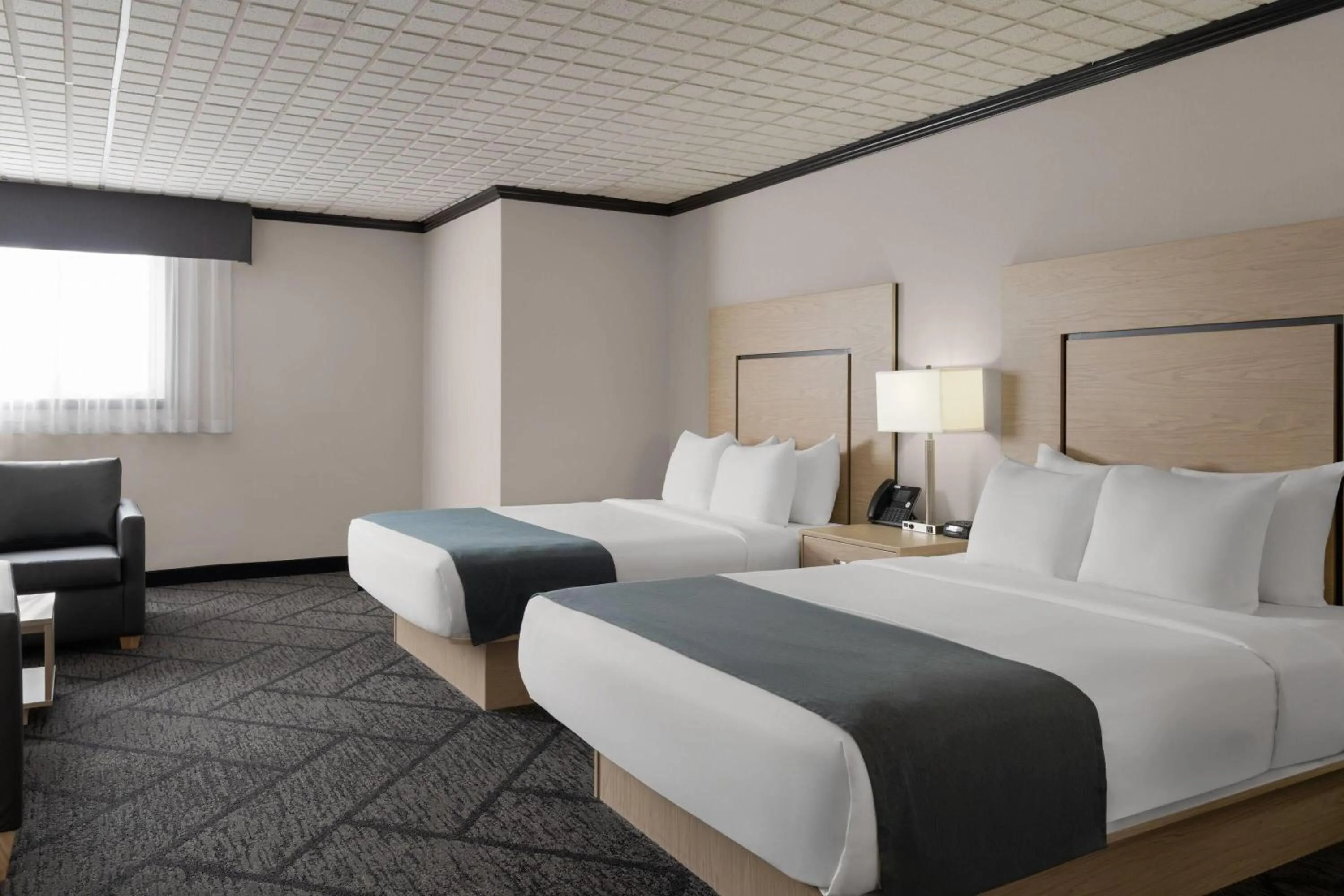 Photo of the whole room, Bed in Sternwheeler Hotel & Conference Centre, Trademark by Wyndham