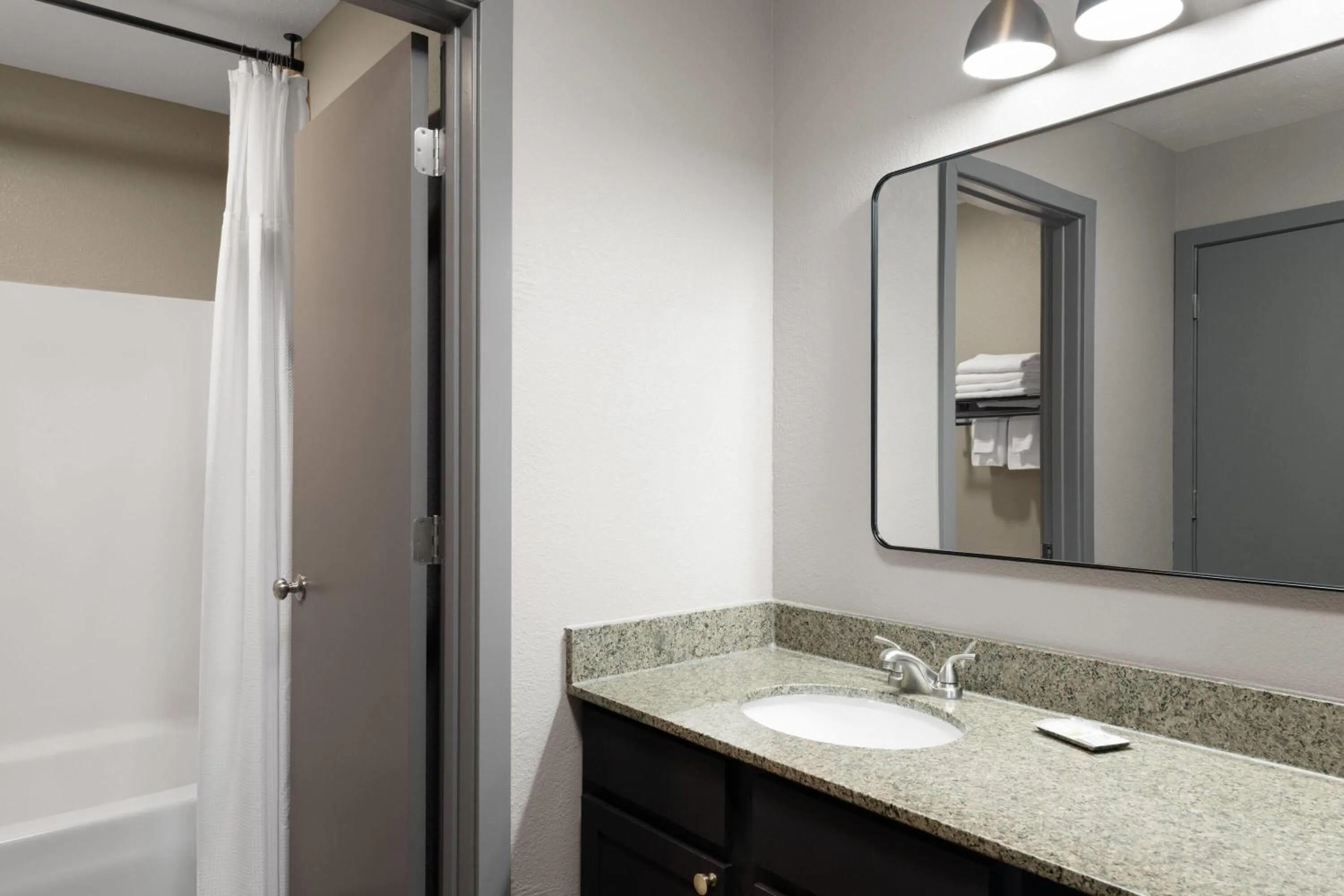 Bathroom in Eastland Suites Hotel & Conference Ctr, Trademark by Wyndham