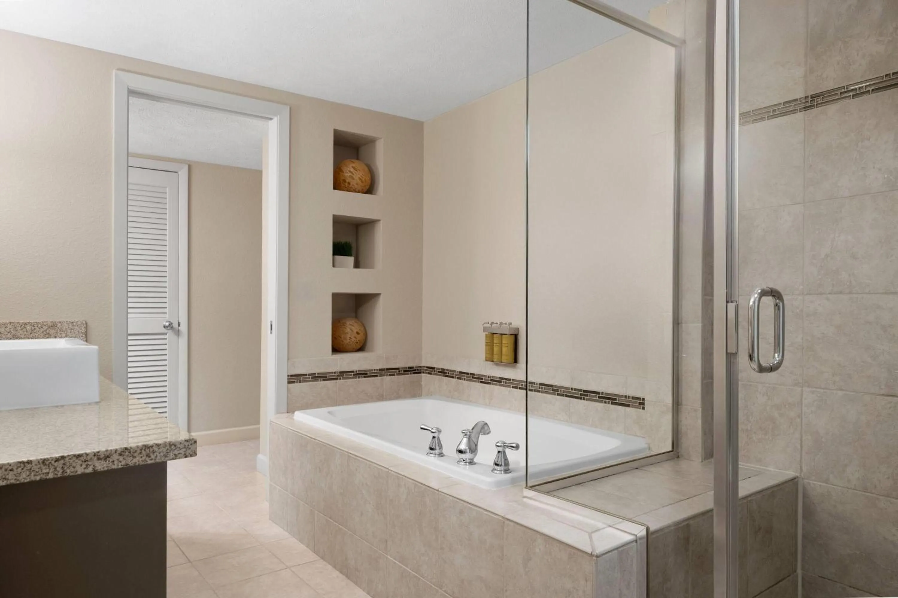 Bathroom in Eastland Suites Hotel & Conference Ctr, Trademark by Wyndham