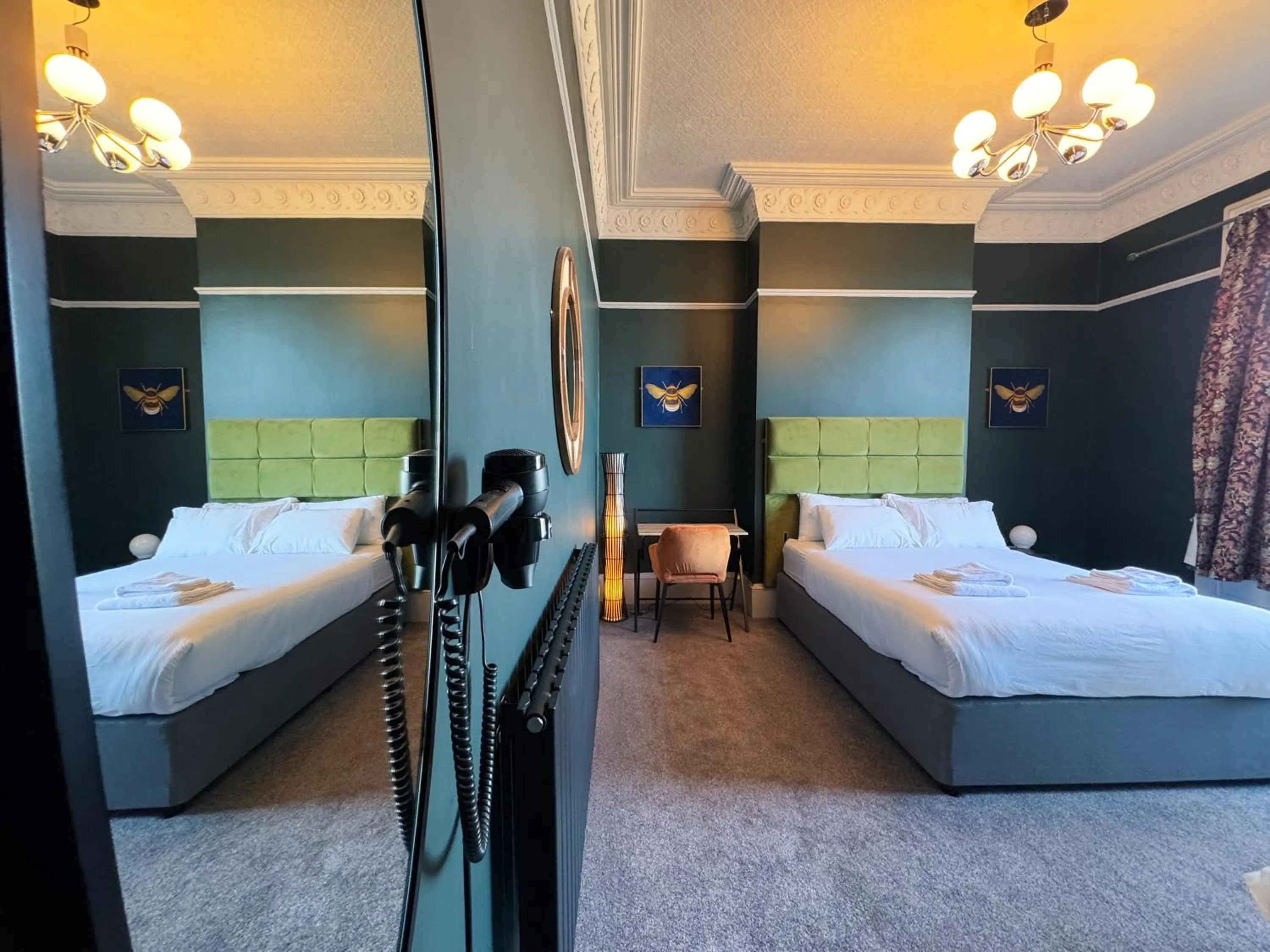 Bed in Nomi Rooms & Restaurant