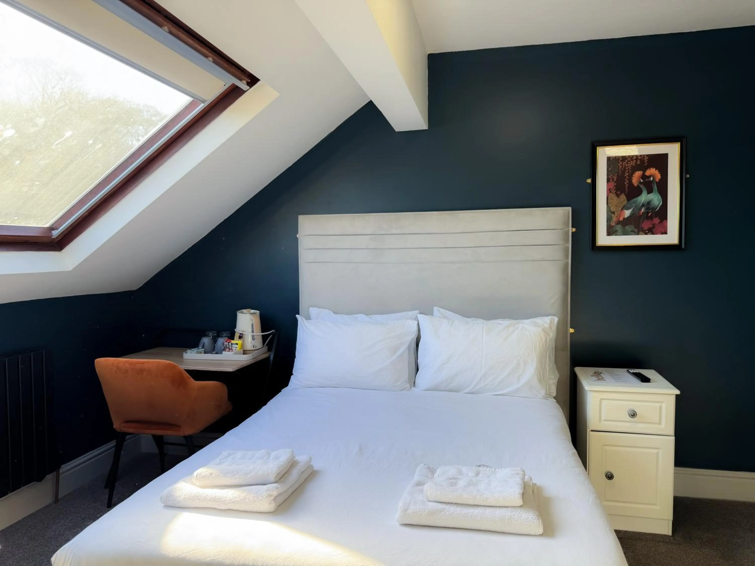 Bed in Nomi Rooms & Restaurant