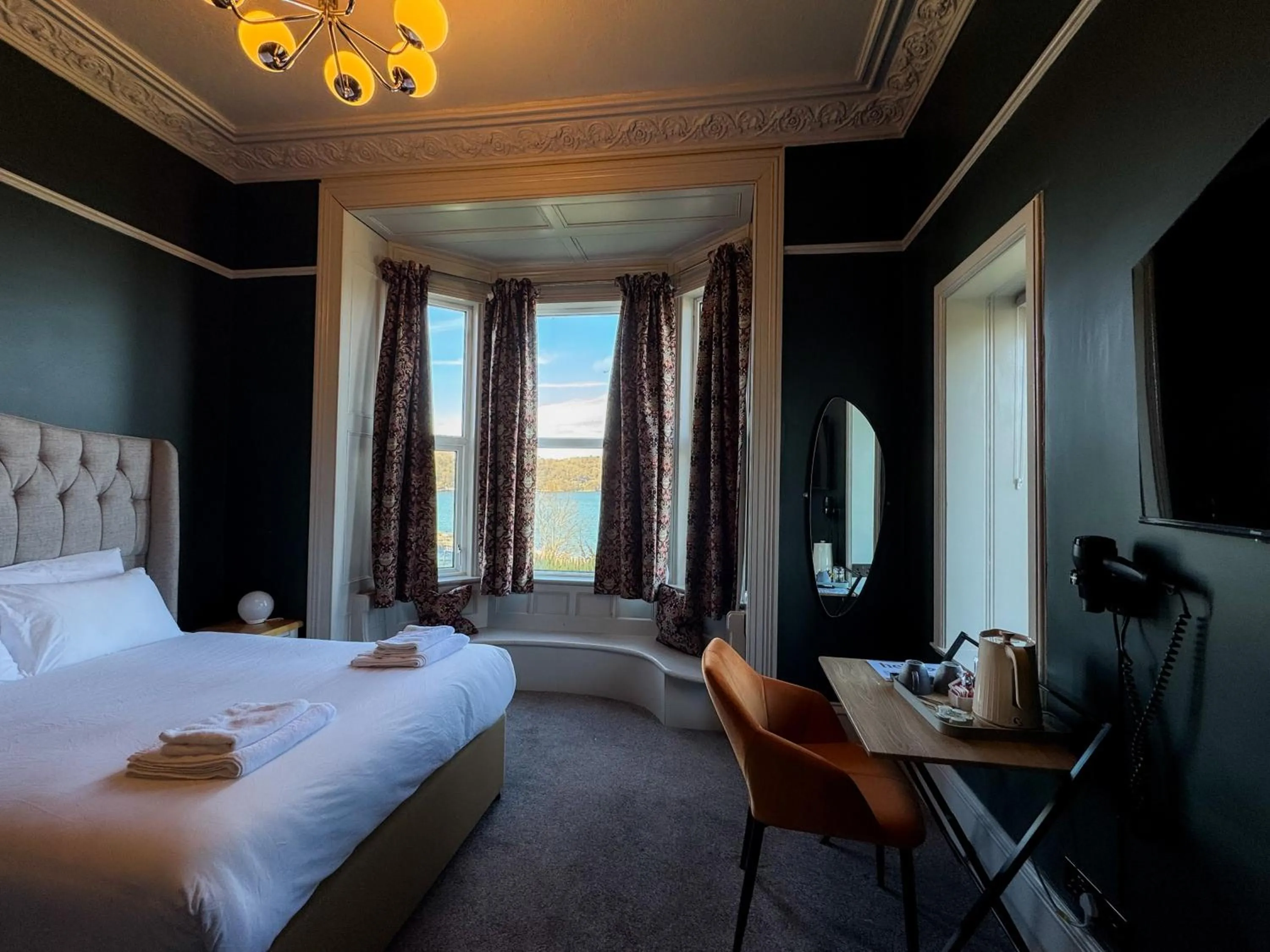 Bed in Nomi Rooms & Restaurant