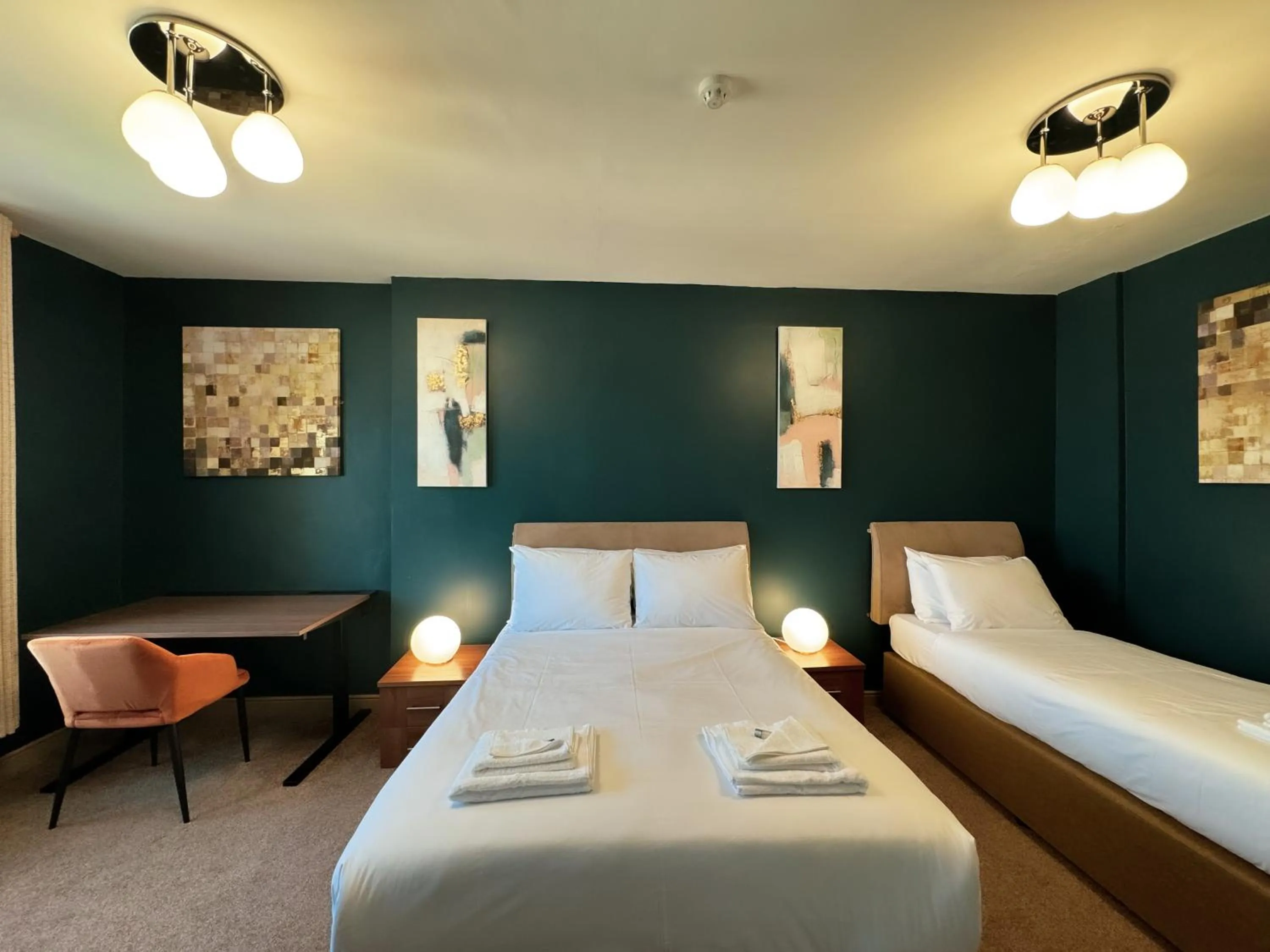 Bed in Nomi Rooms & Restaurant