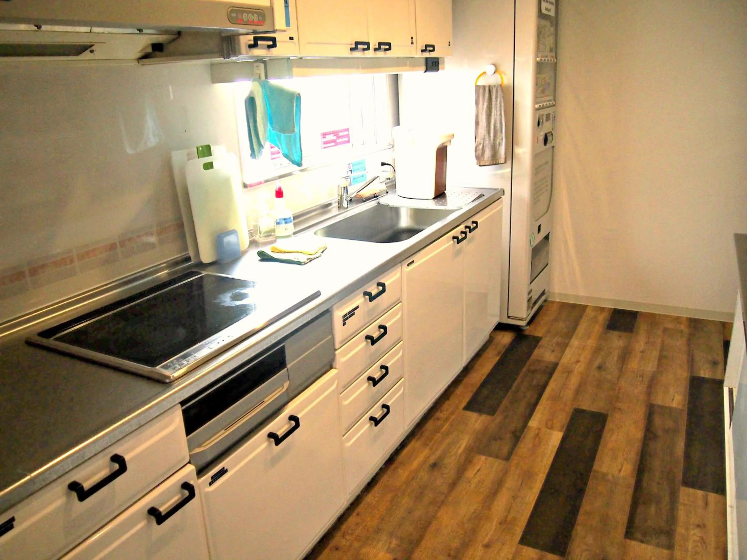 Kitchen or kitchenette in J-Hoppers Hiroshima Guesthouse