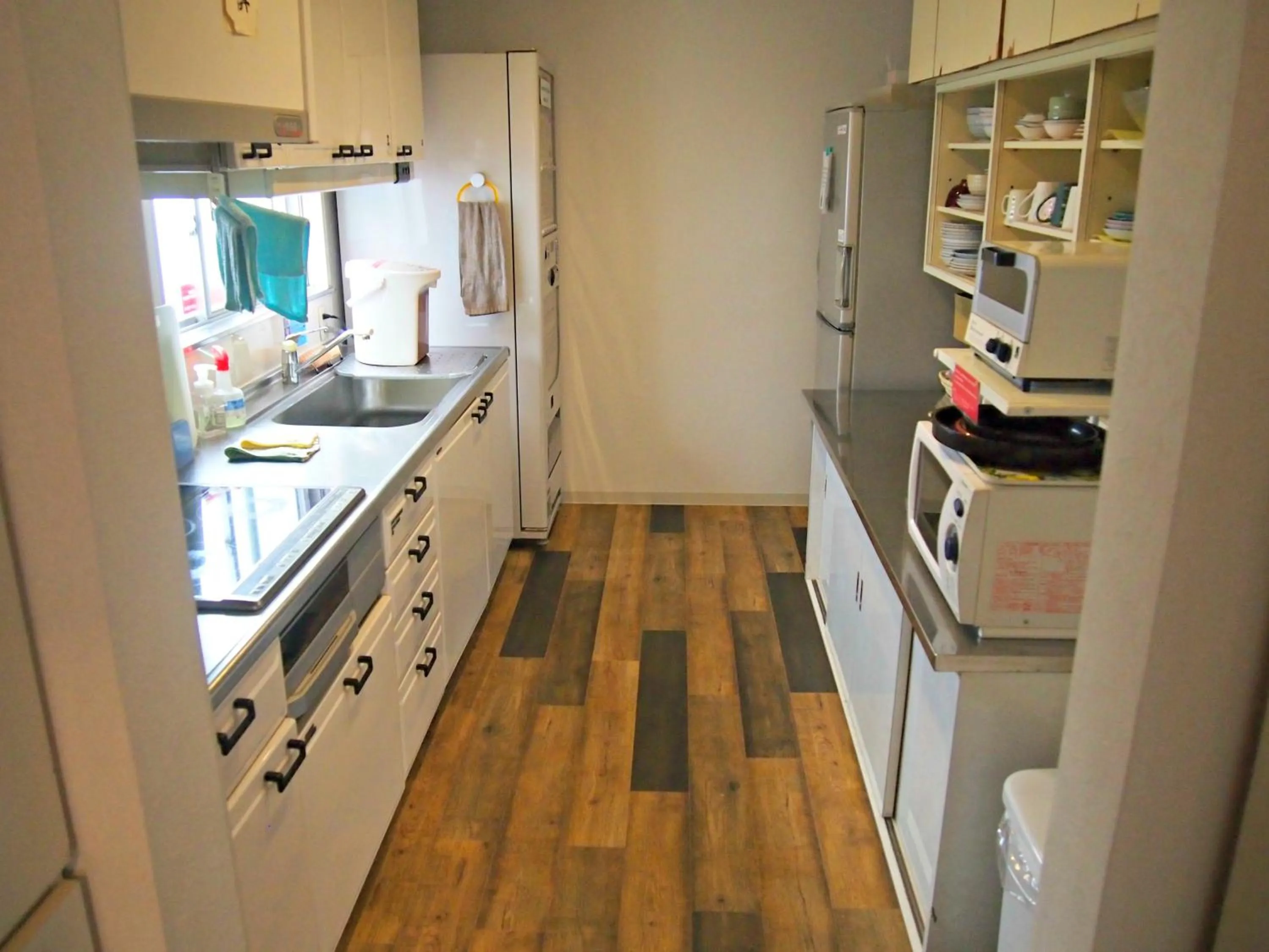 Communal kitchen in J-Hoppers Hiroshima Guesthouse