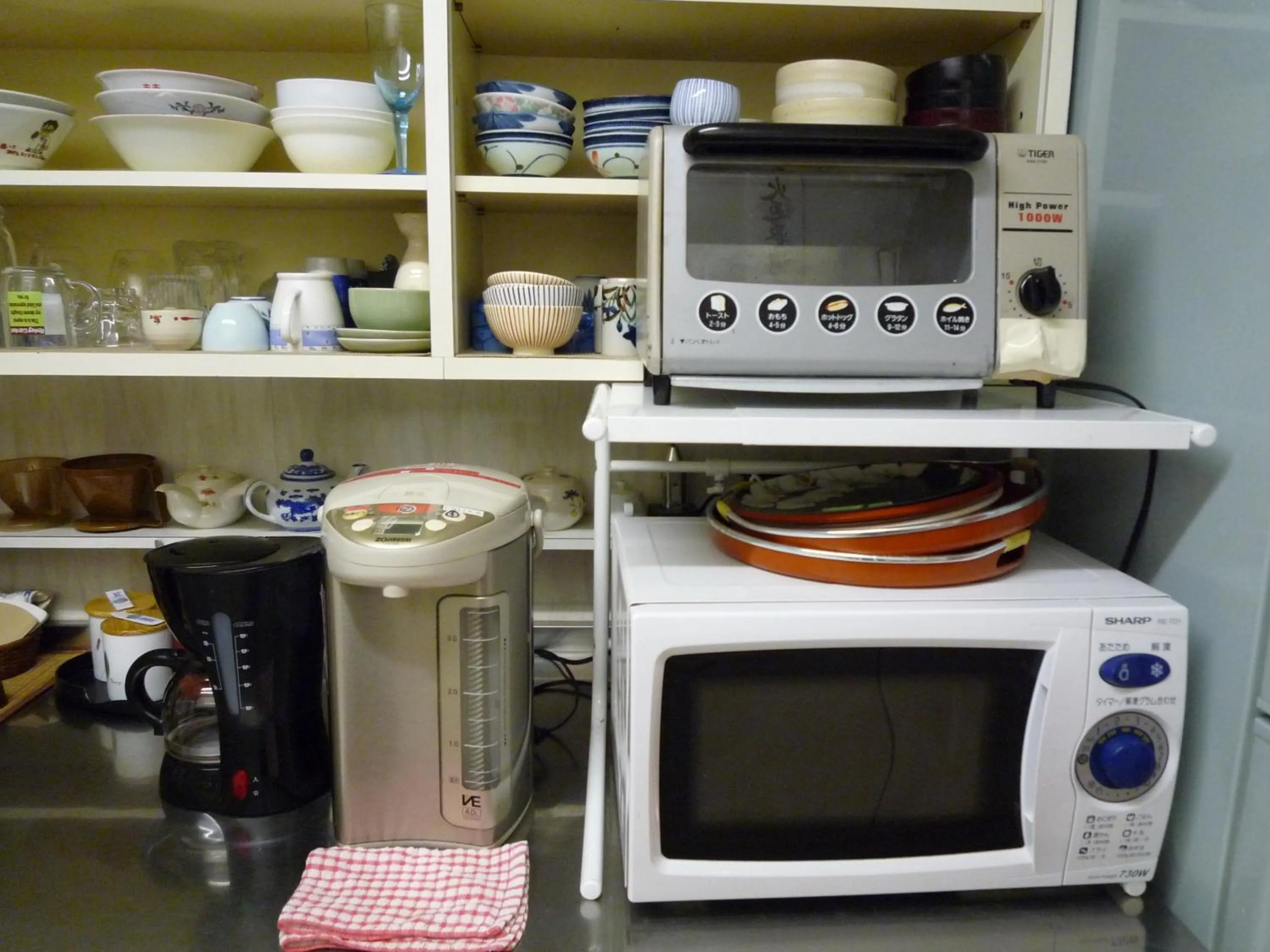 Kitchen or kitchenette in J-Hoppers Hiroshima Guesthouse