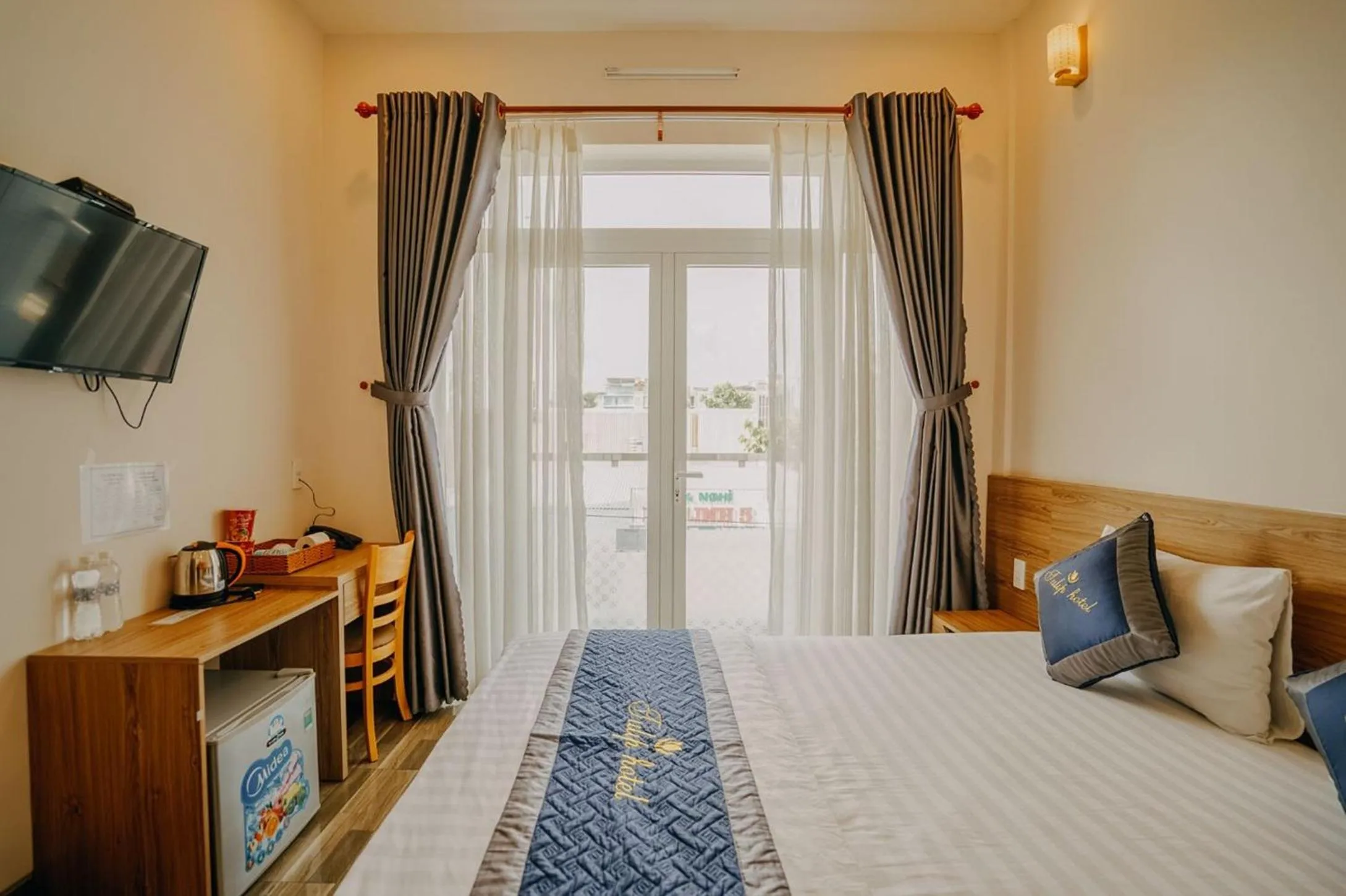 Photo of the whole room, Bed in Tulip Hotel