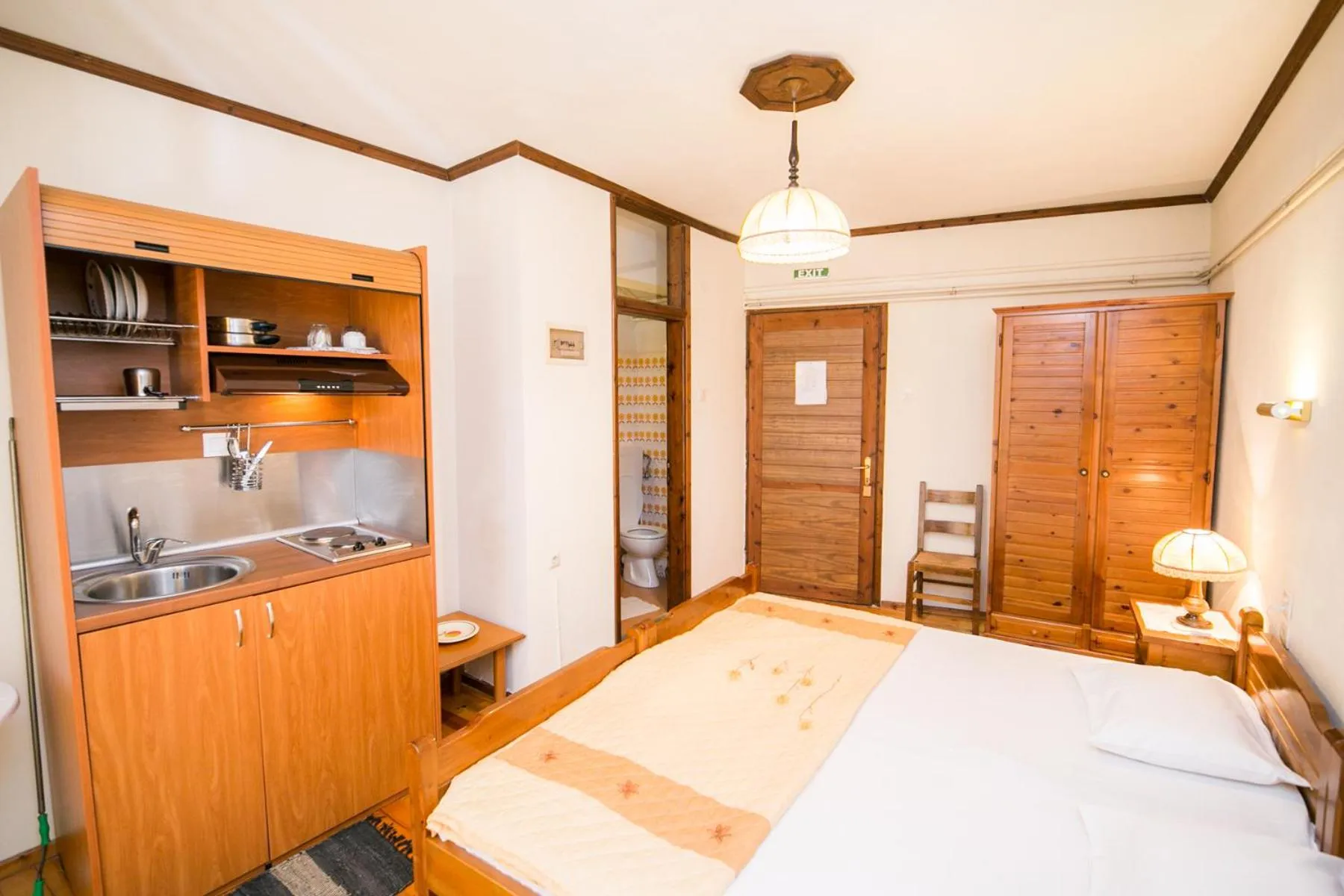 Kitchen or kitchenette, Bed in Apartments Hotel Magani