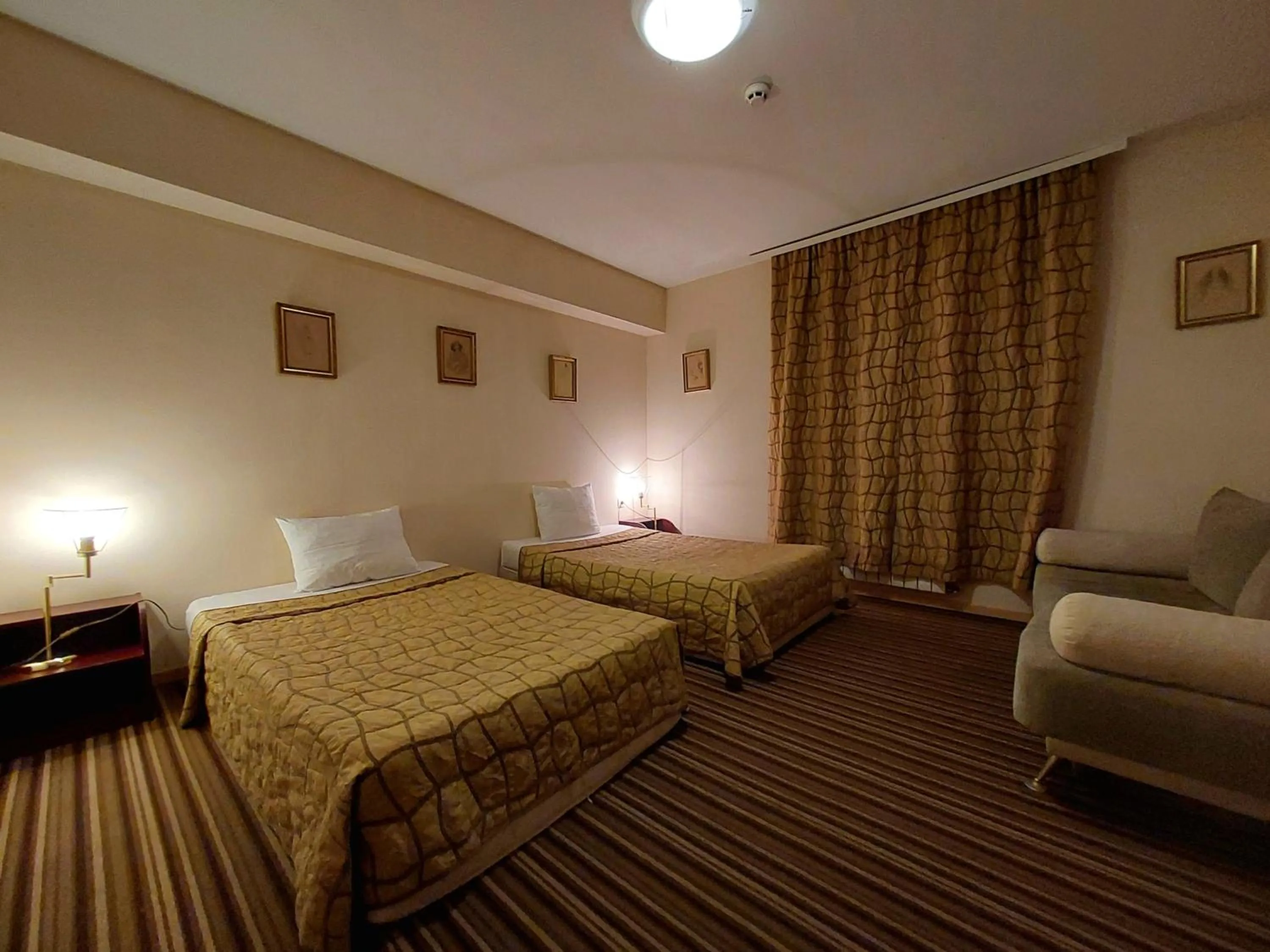 Bed in Family Art Hotel Gallery