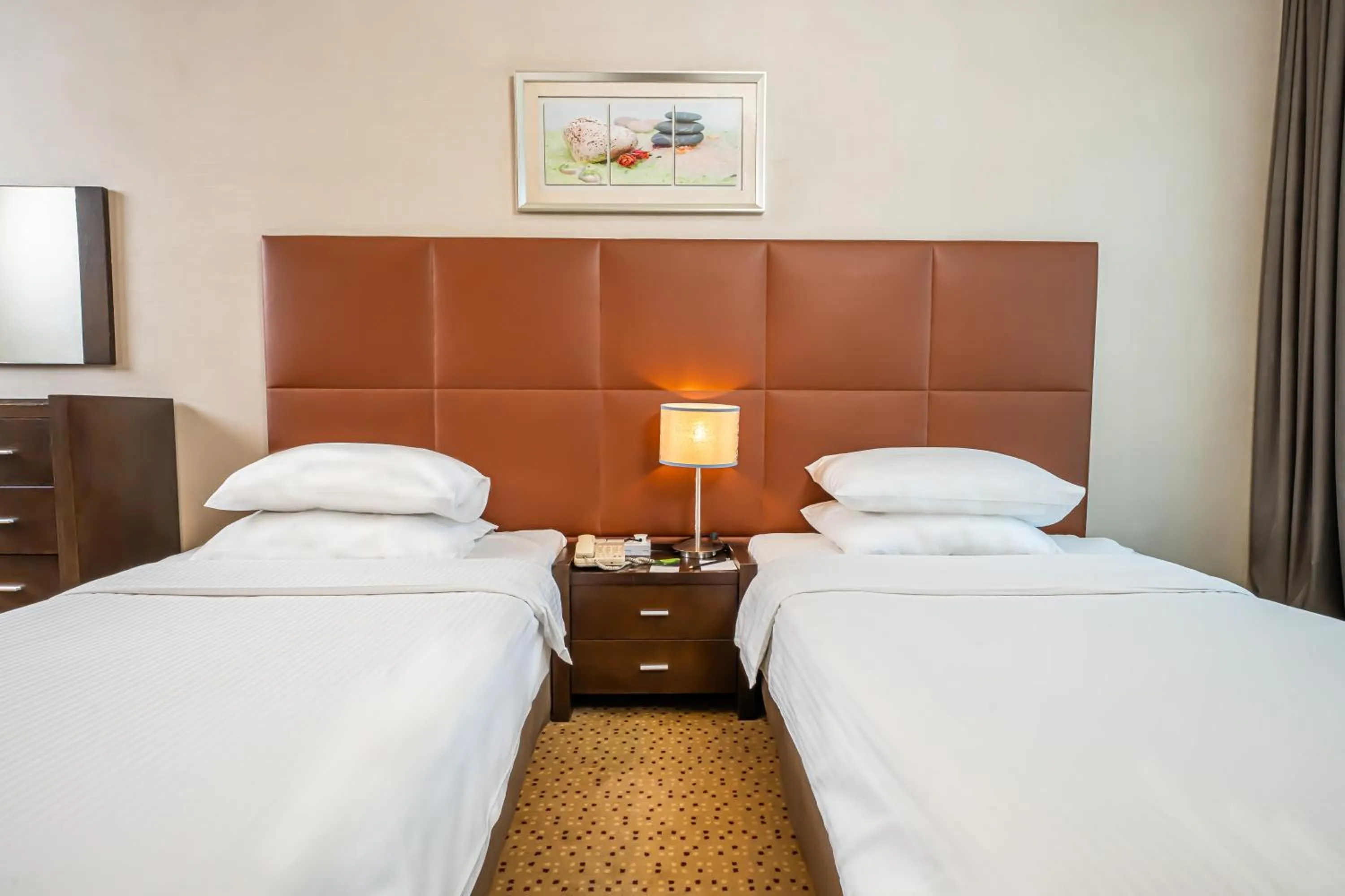 Bed in Kingsgate Hotel Doha by Millennium Hotels