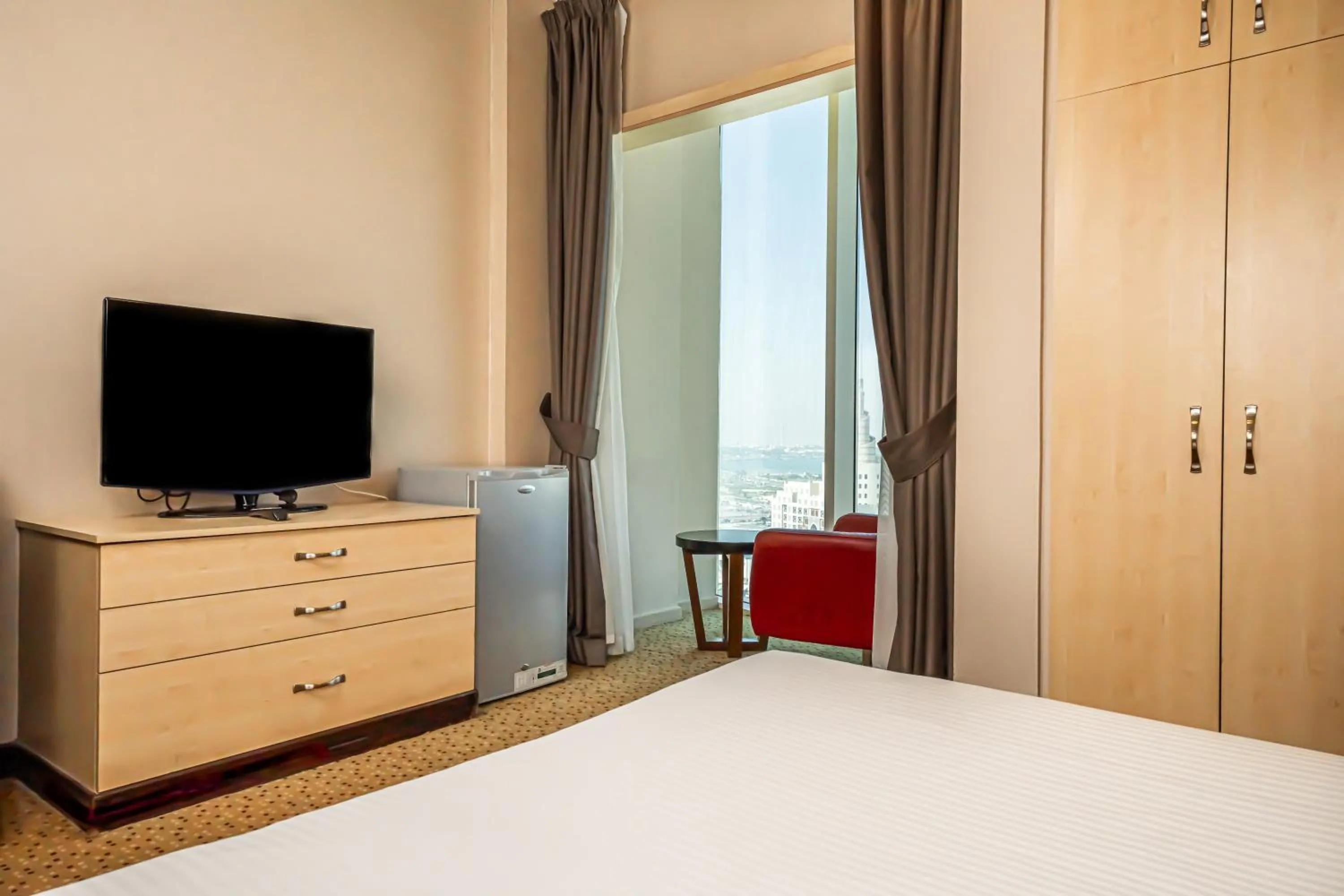 Bed in Kingsgate Hotel Doha by Millennium Hotels