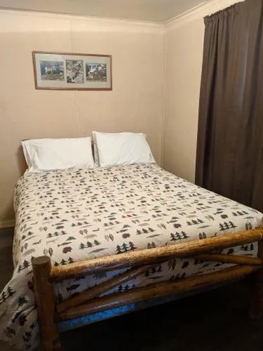 Bed in Columbine Cabins