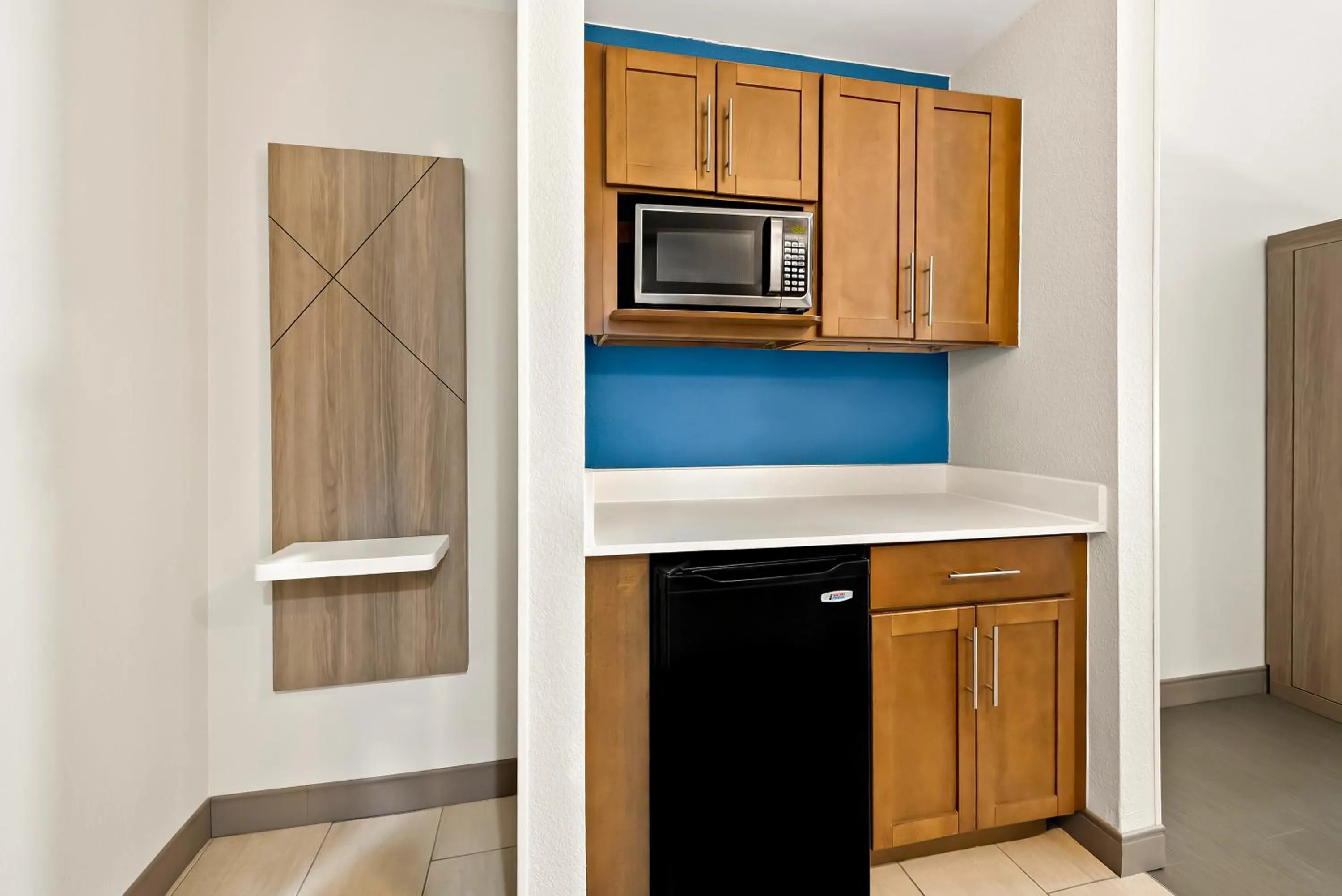 kitchen in Holiday Inn Express & Suites Raleigh NE - Medical Ctr Area by IHG