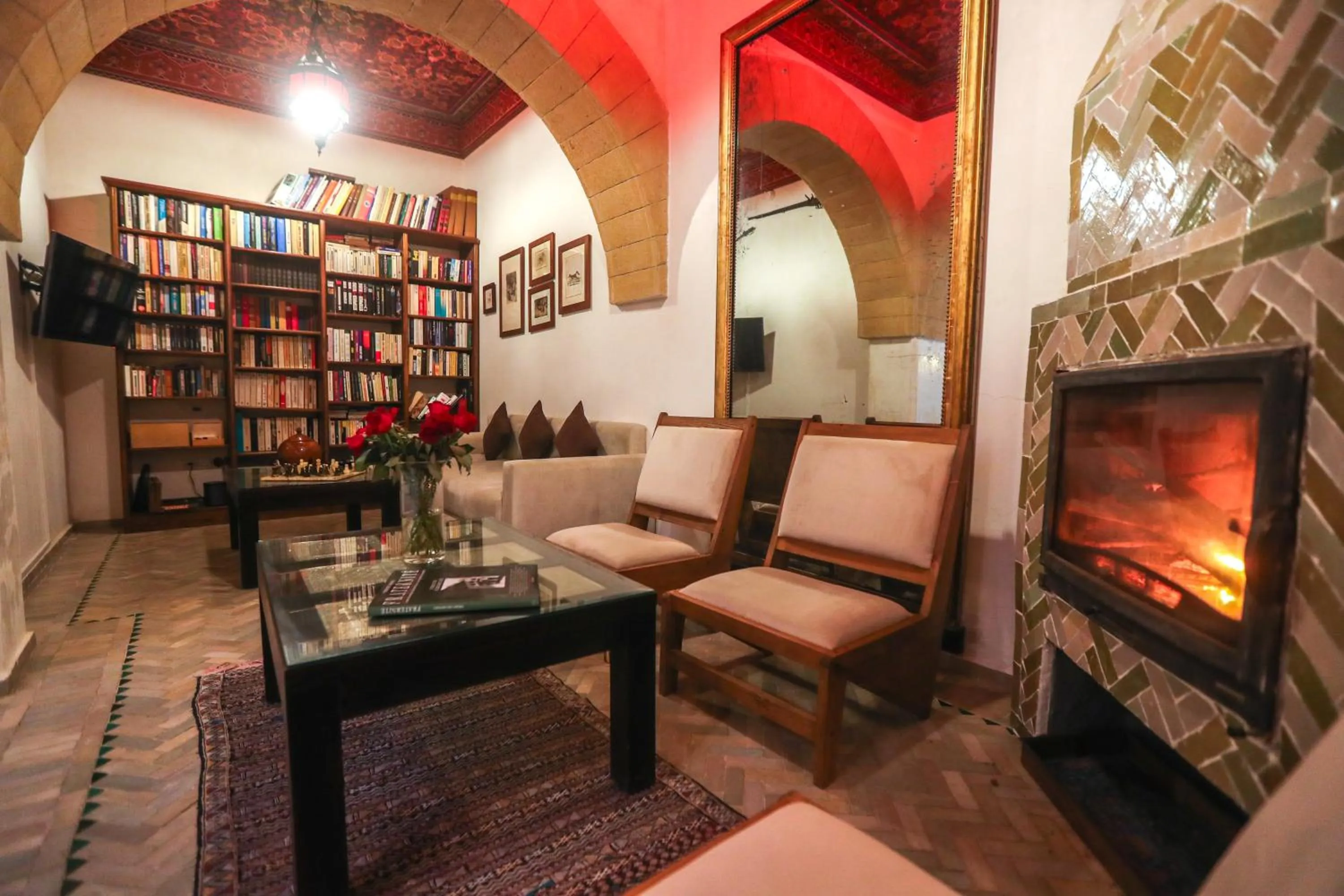 Communal lounge/ TV room in Riad Perle D'Eau