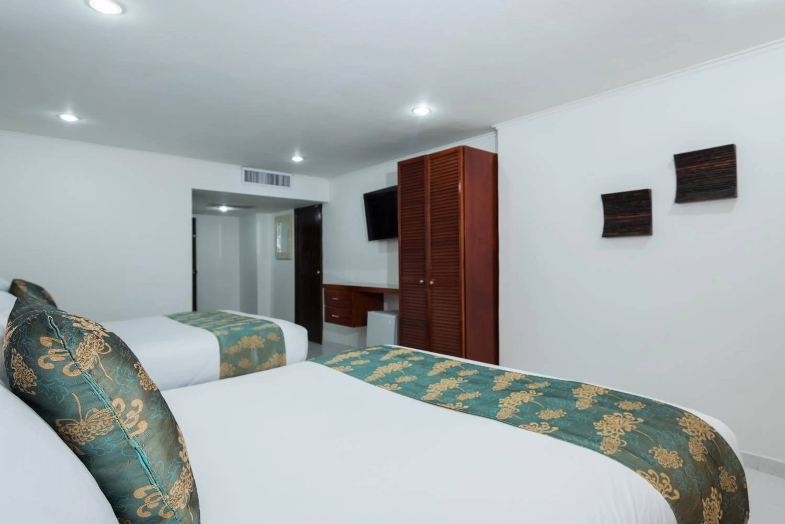 Bed in Calypso Beach Hotel