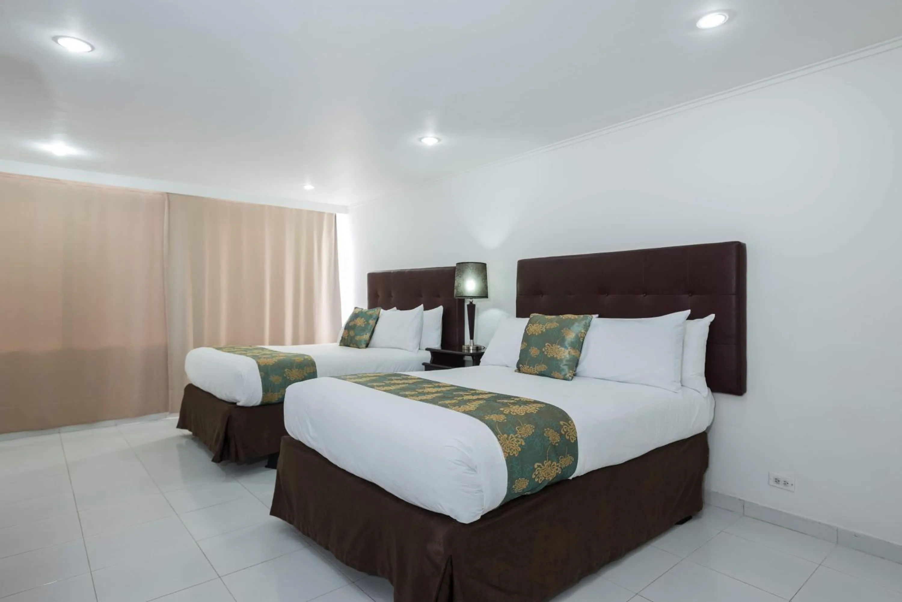 Bed in Calypso Beach Hotel
