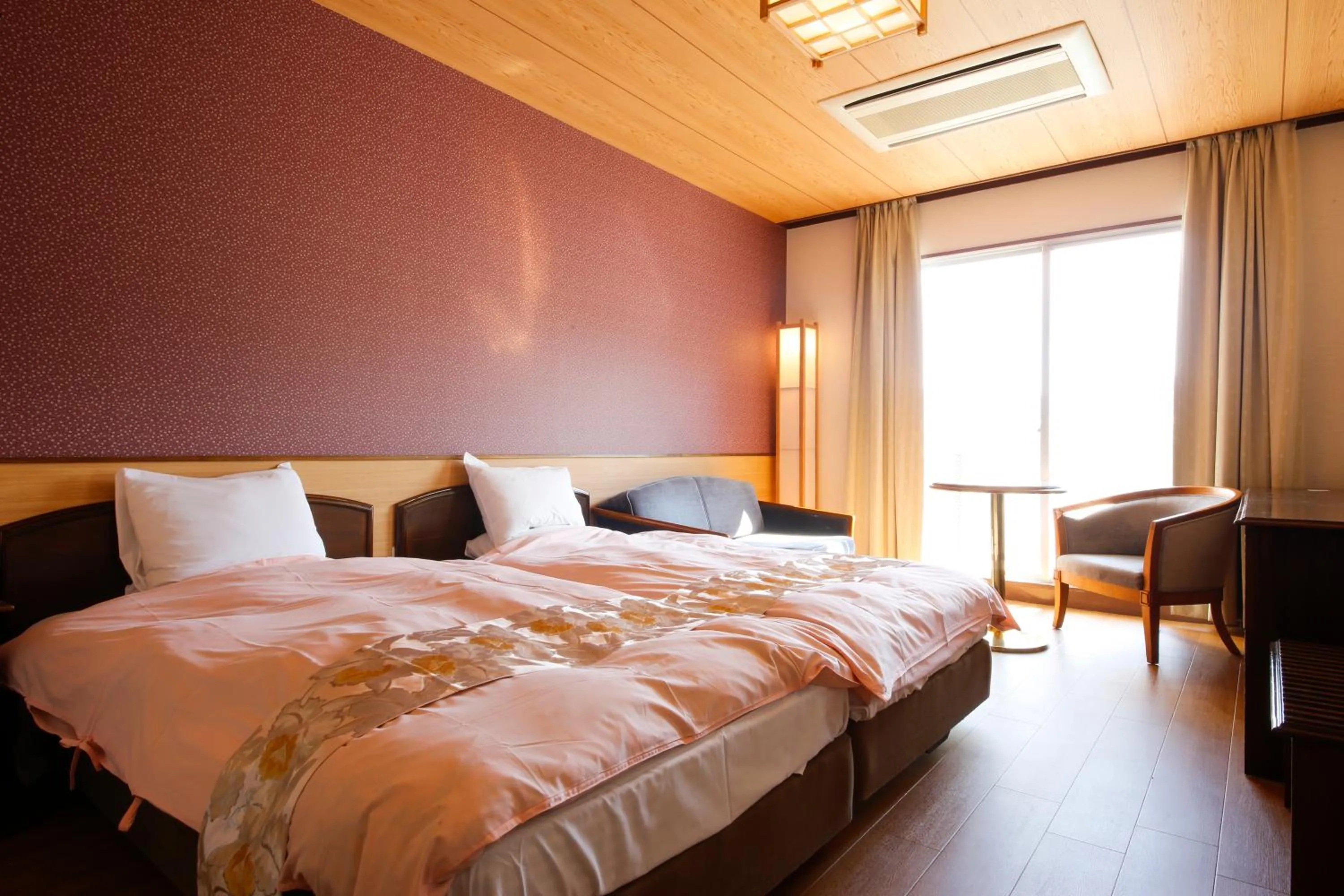 Bed in Hinotani Onsen Misugi Resort