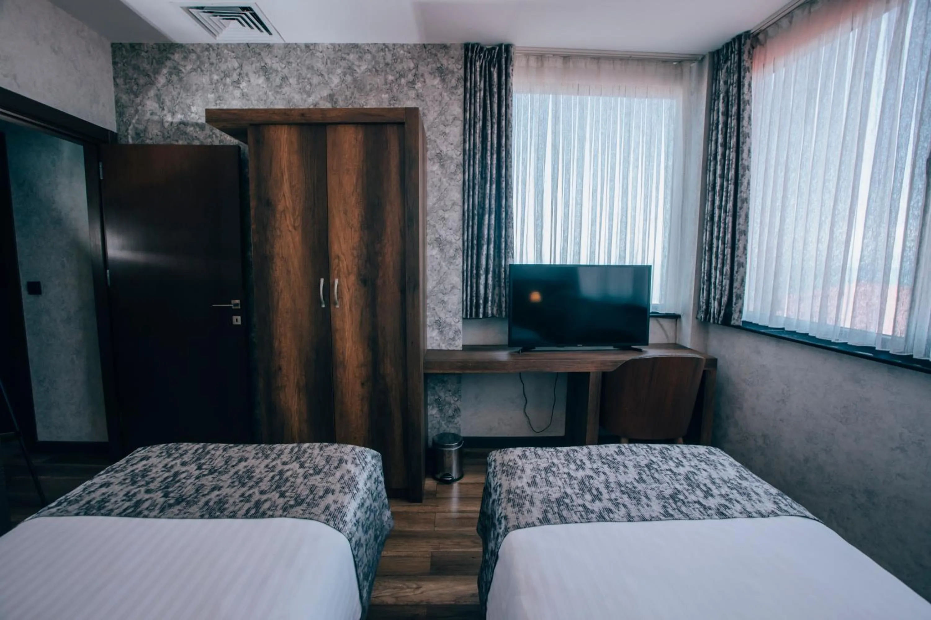 Communal lounge/ TV room, Bed in Life Point Hotel