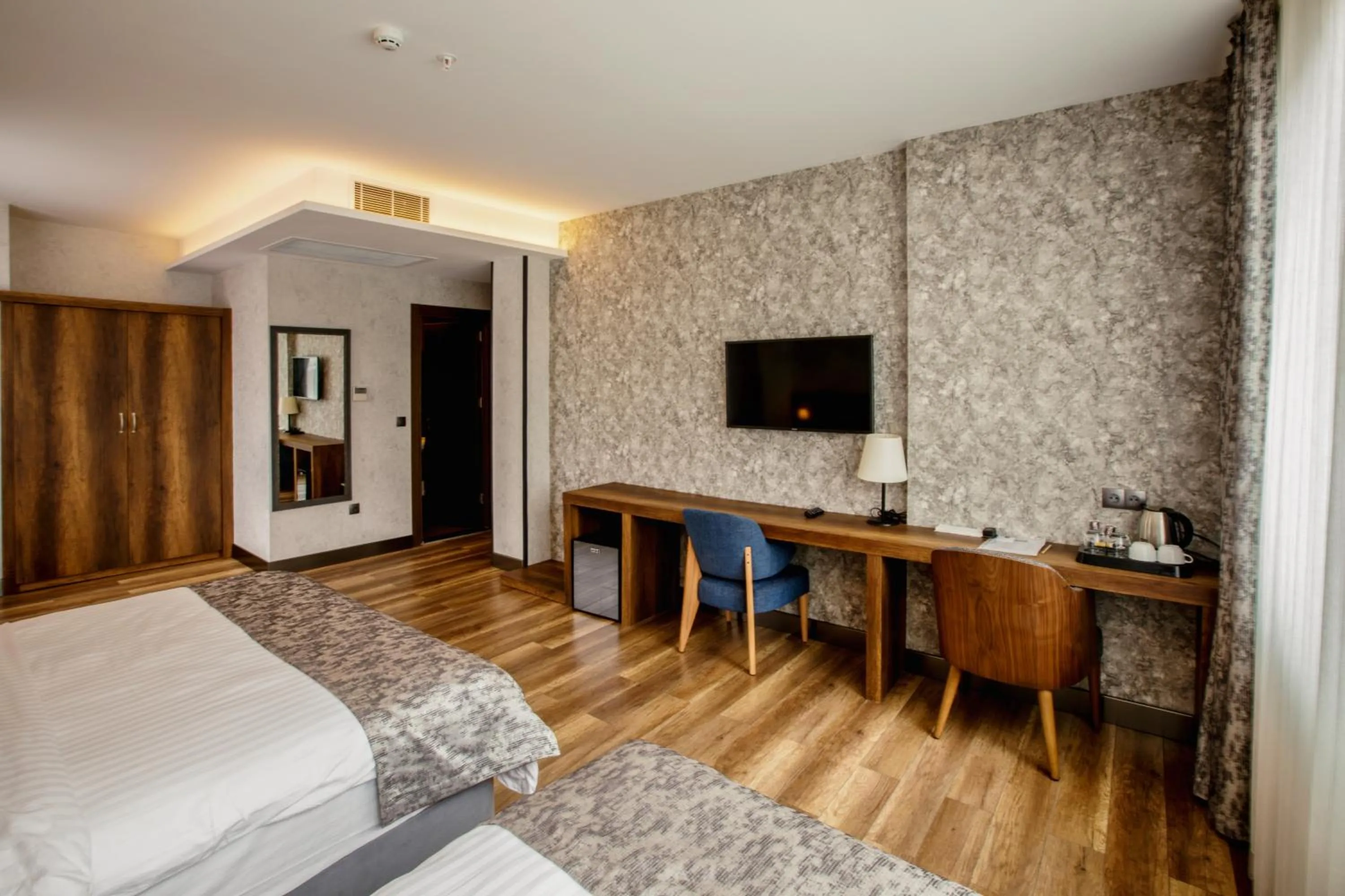 Communal lounge/ TV room, Bed in Life Point Hotel