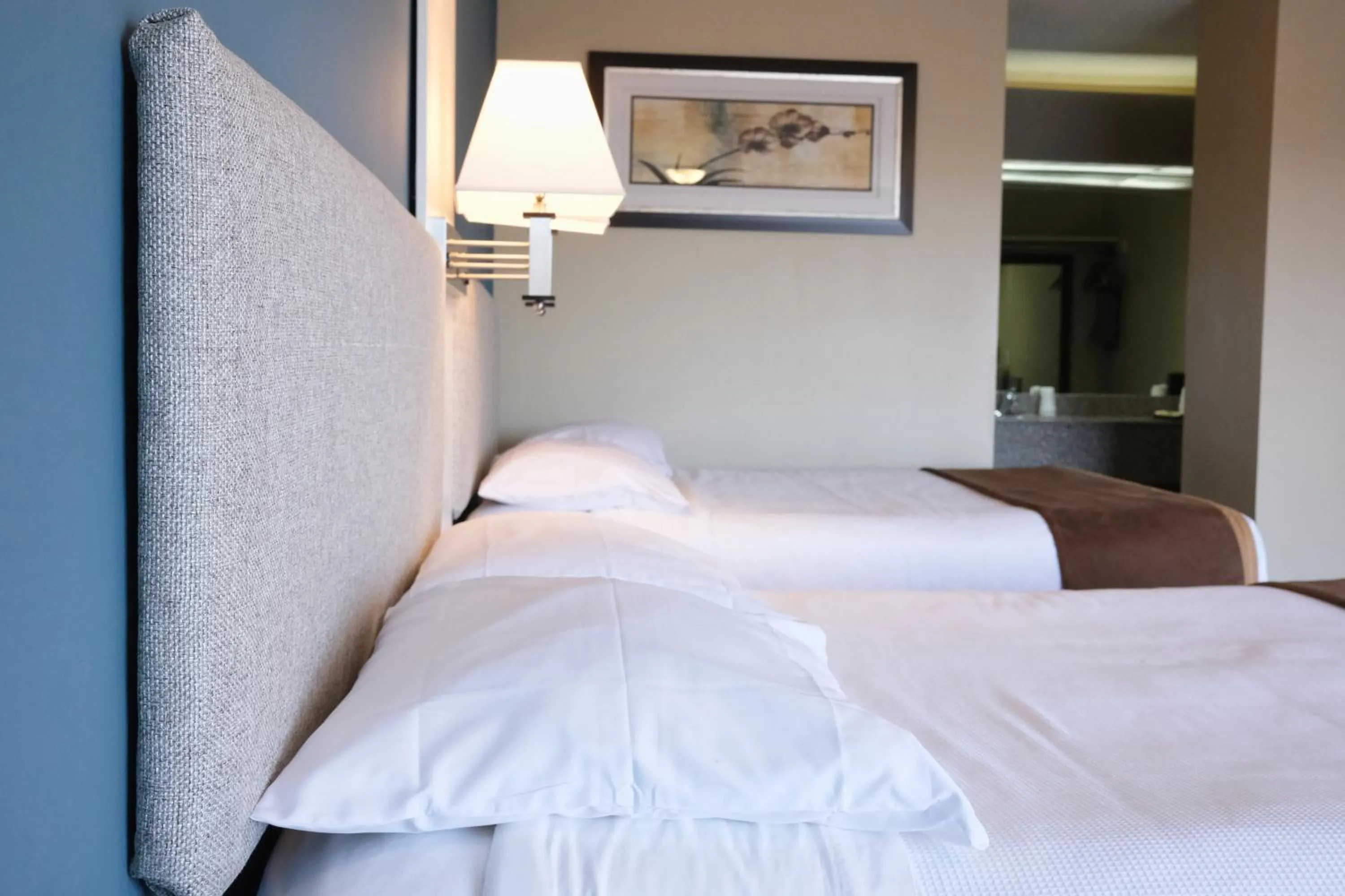 Bed in Regency Inn of Eddyville Kuttawa