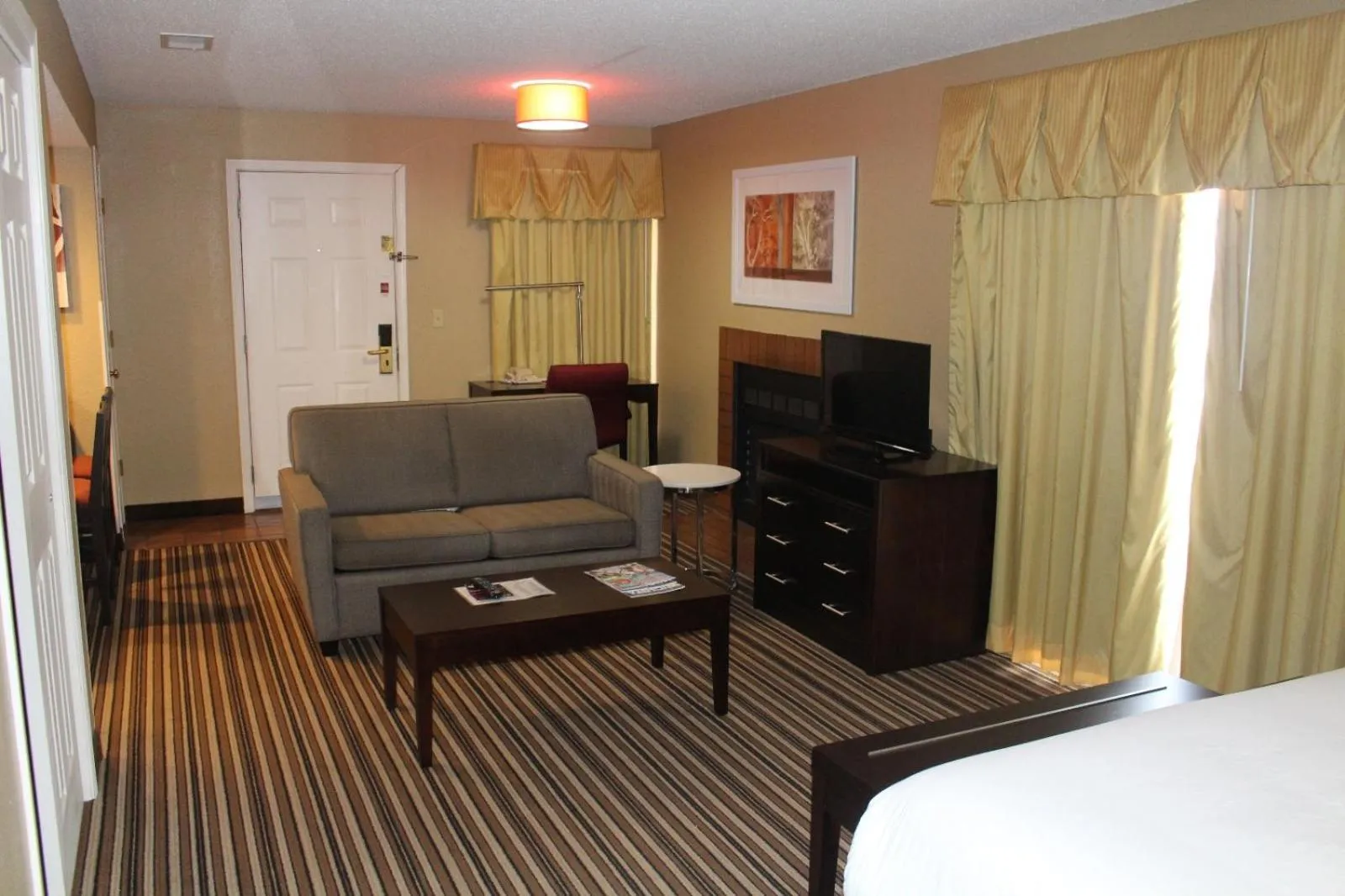Living room, Bed in Hawthorn Extended Stay by Wyndham Wichita