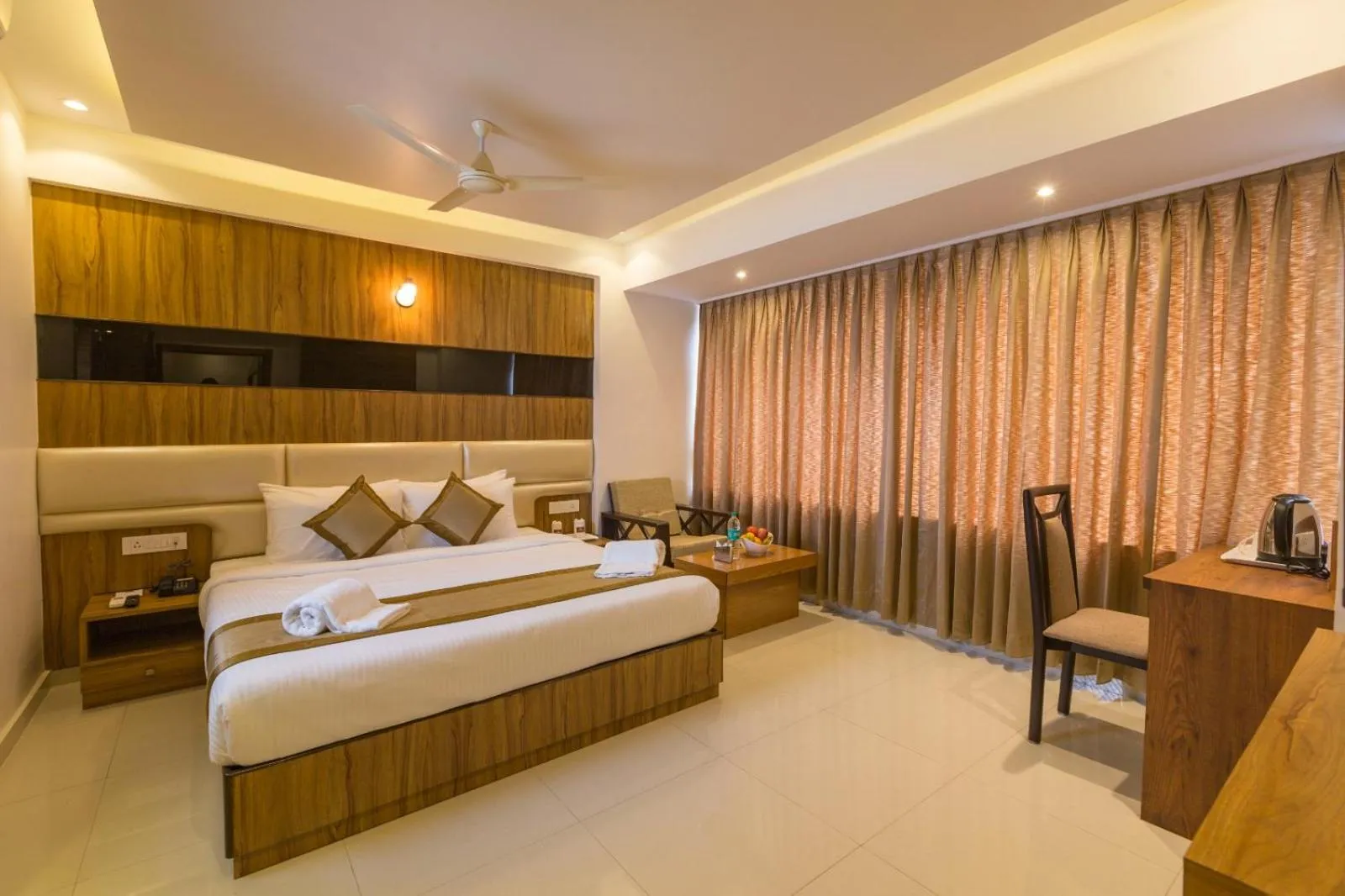 Bed in Grand Plaza Suites