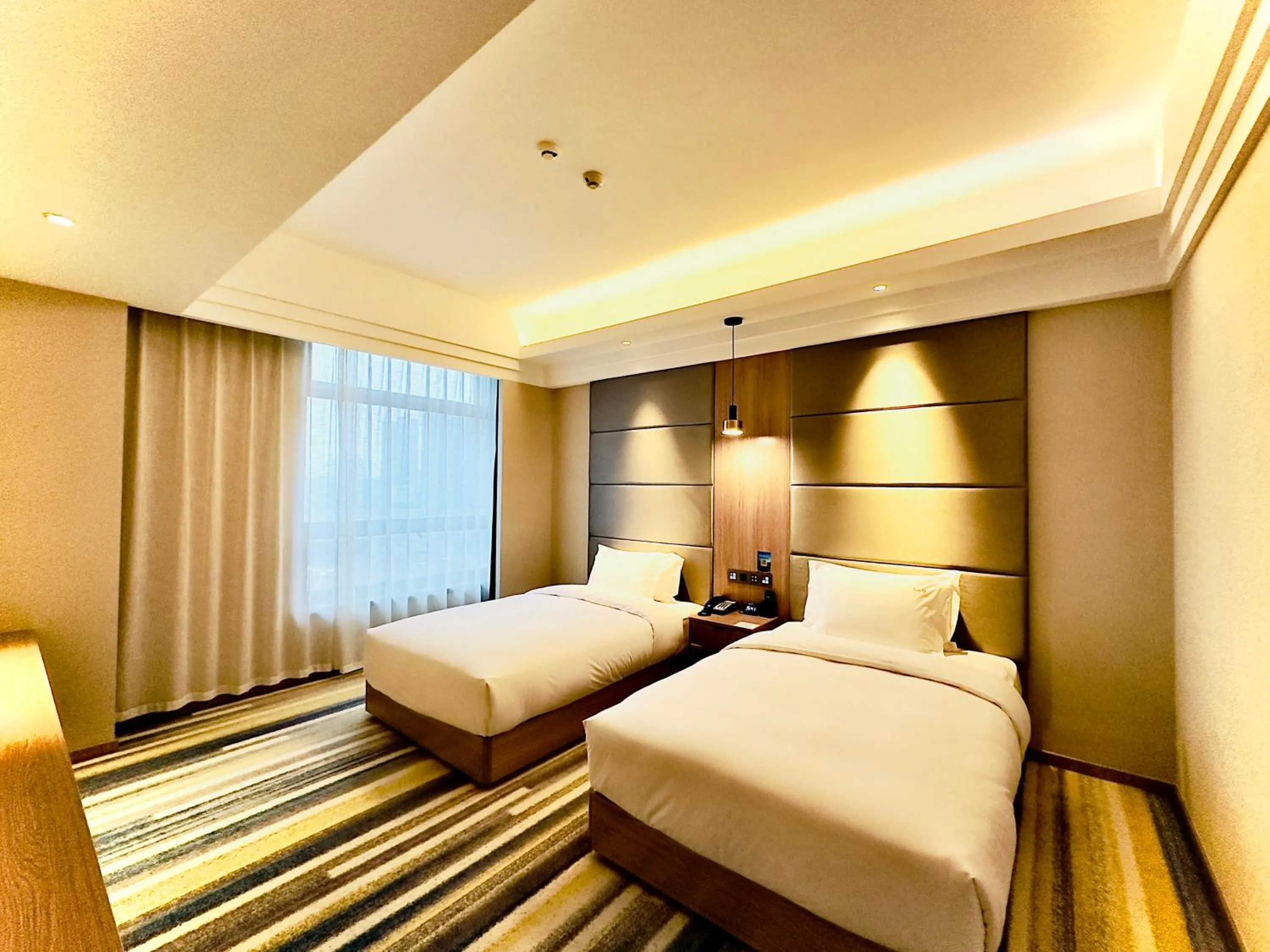 Photo of the whole room, Bed in Holiday Inn Nantong Oasis International by IHG
