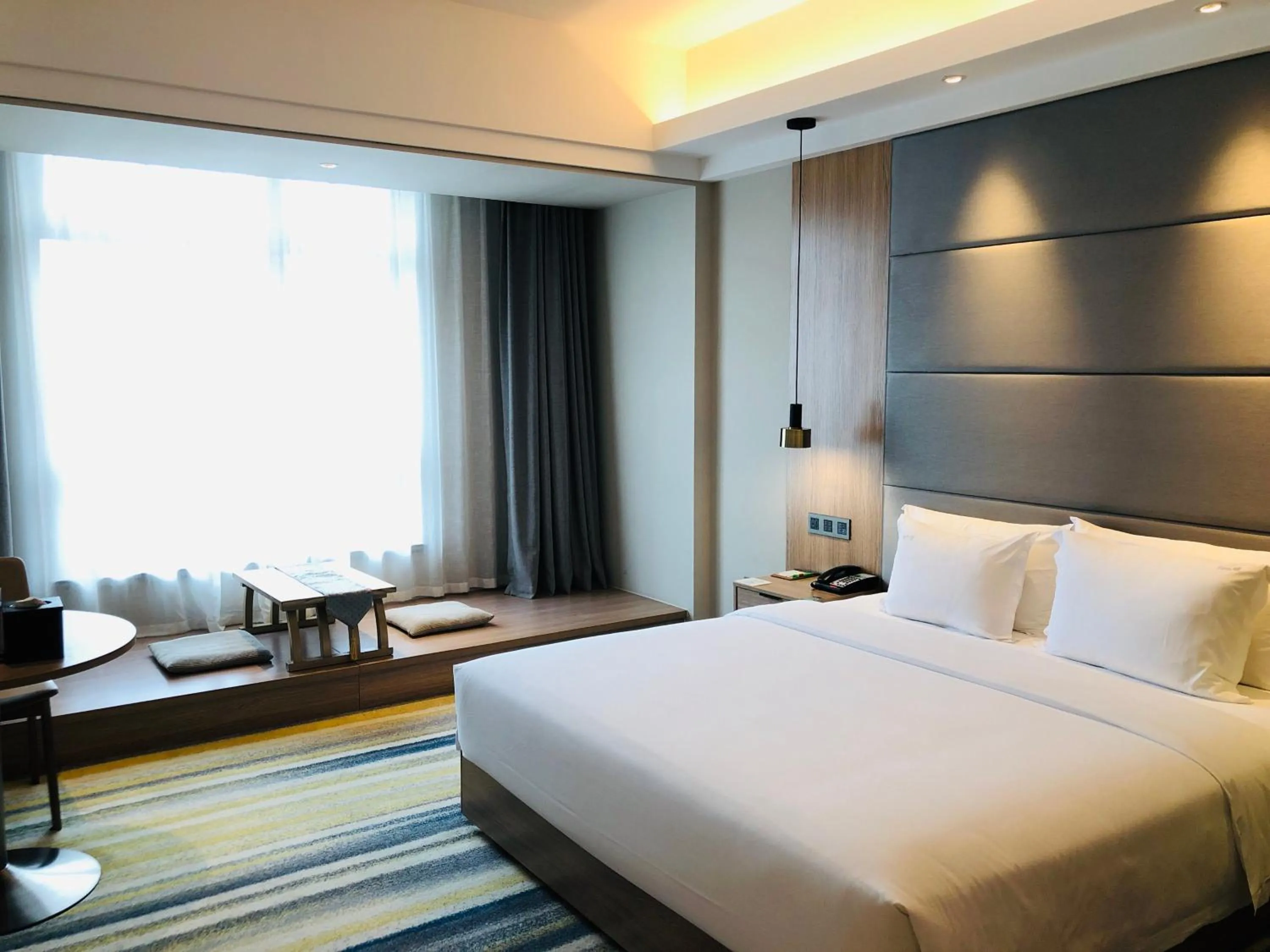 Photo of the whole room, Bed in Holiday Inn Nantong Oasis International by IHG