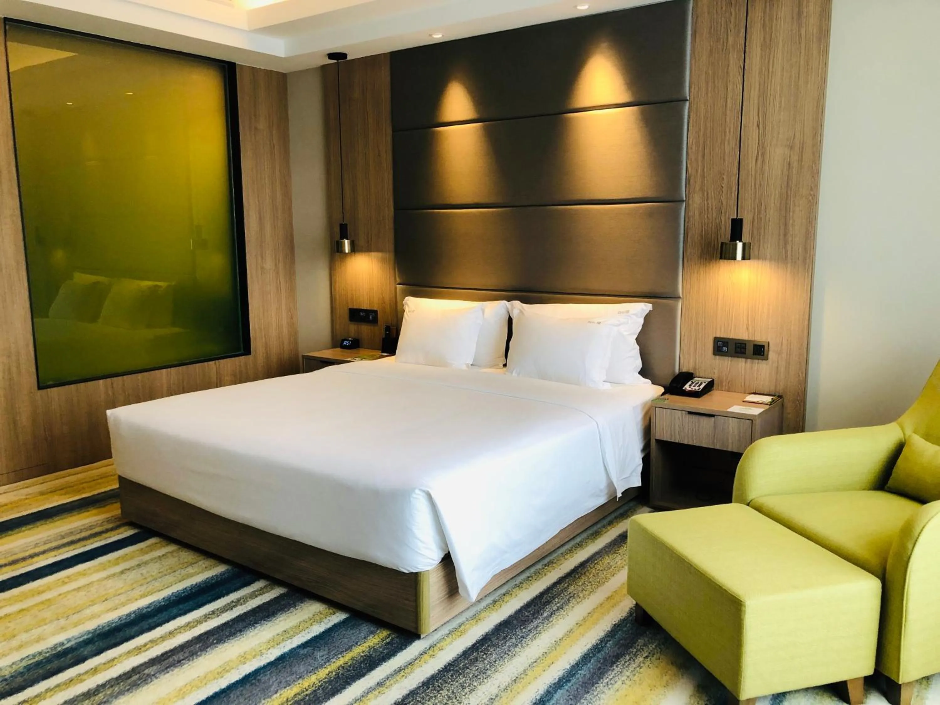 Photo of the whole room, Bed in Holiday Inn Nantong Oasis International by IHG